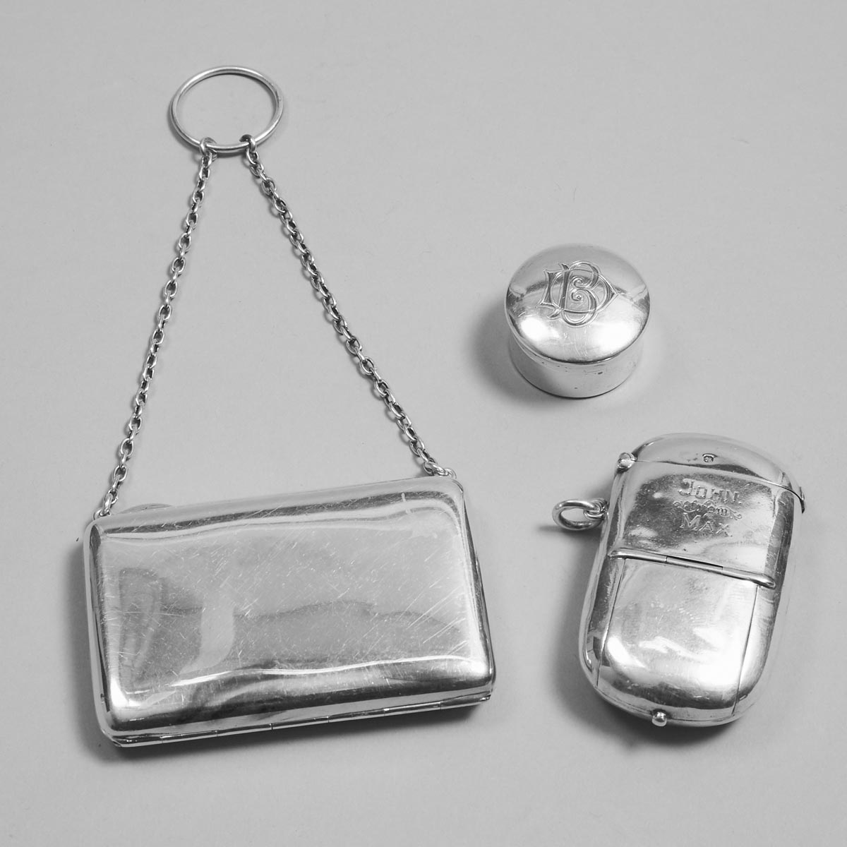 Late Victorian, Edwardian and Later English Silver Small Purse, Circular Box and a Vesta Case, c.1898-1916
