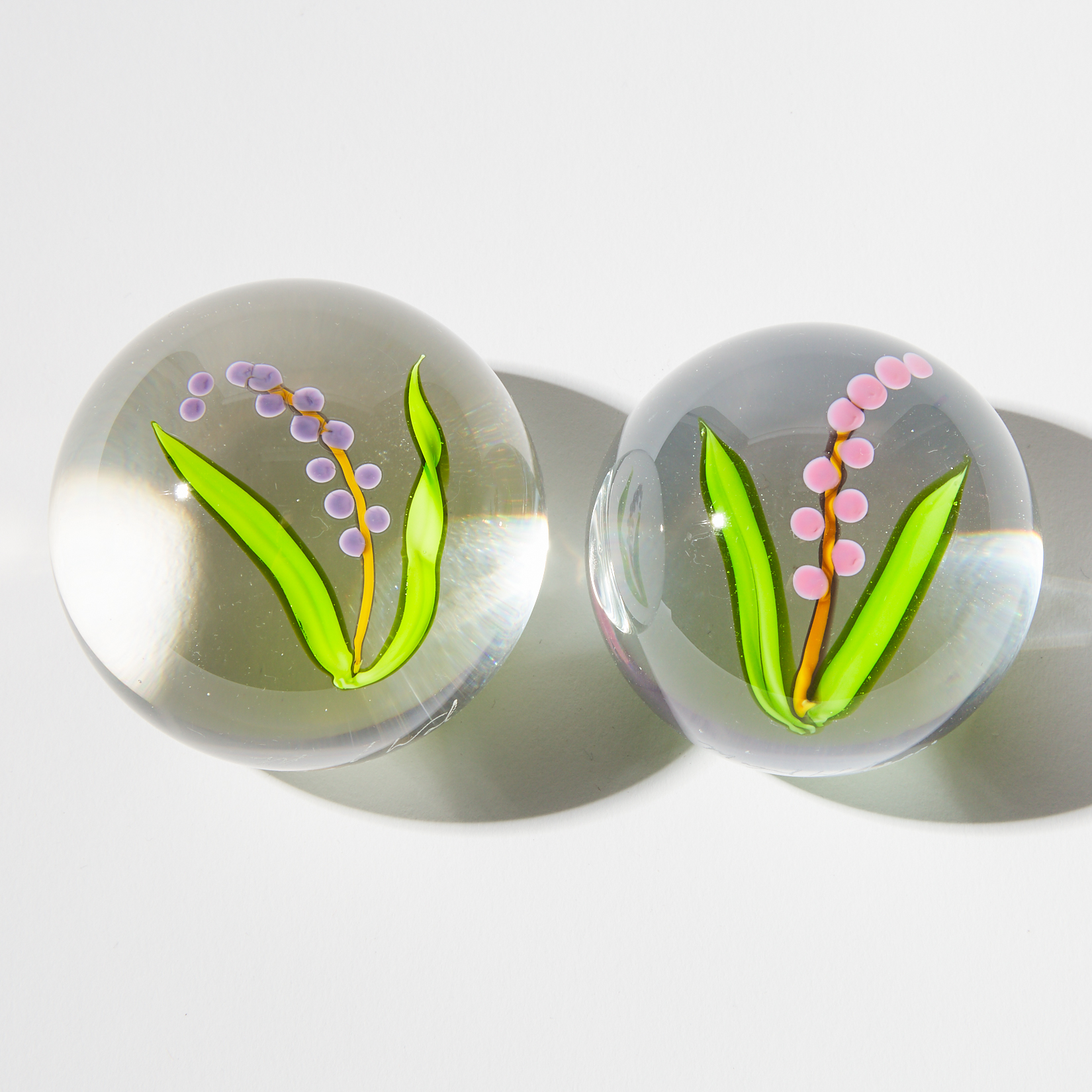 Mayauel Ward (American, b. 1956), Two Lily of the Valley Glass Paperweights, 2009
