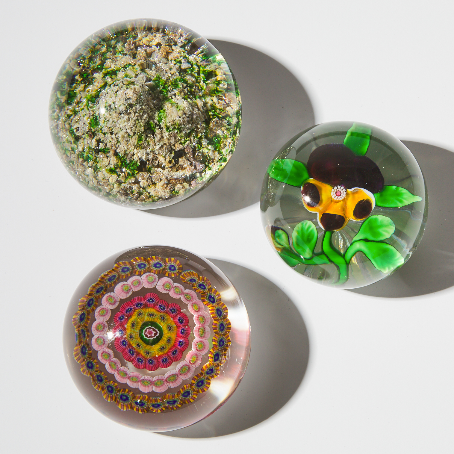 Baccarat Pansy, Concentric, and Rock Ground Paperweights, 19th century
