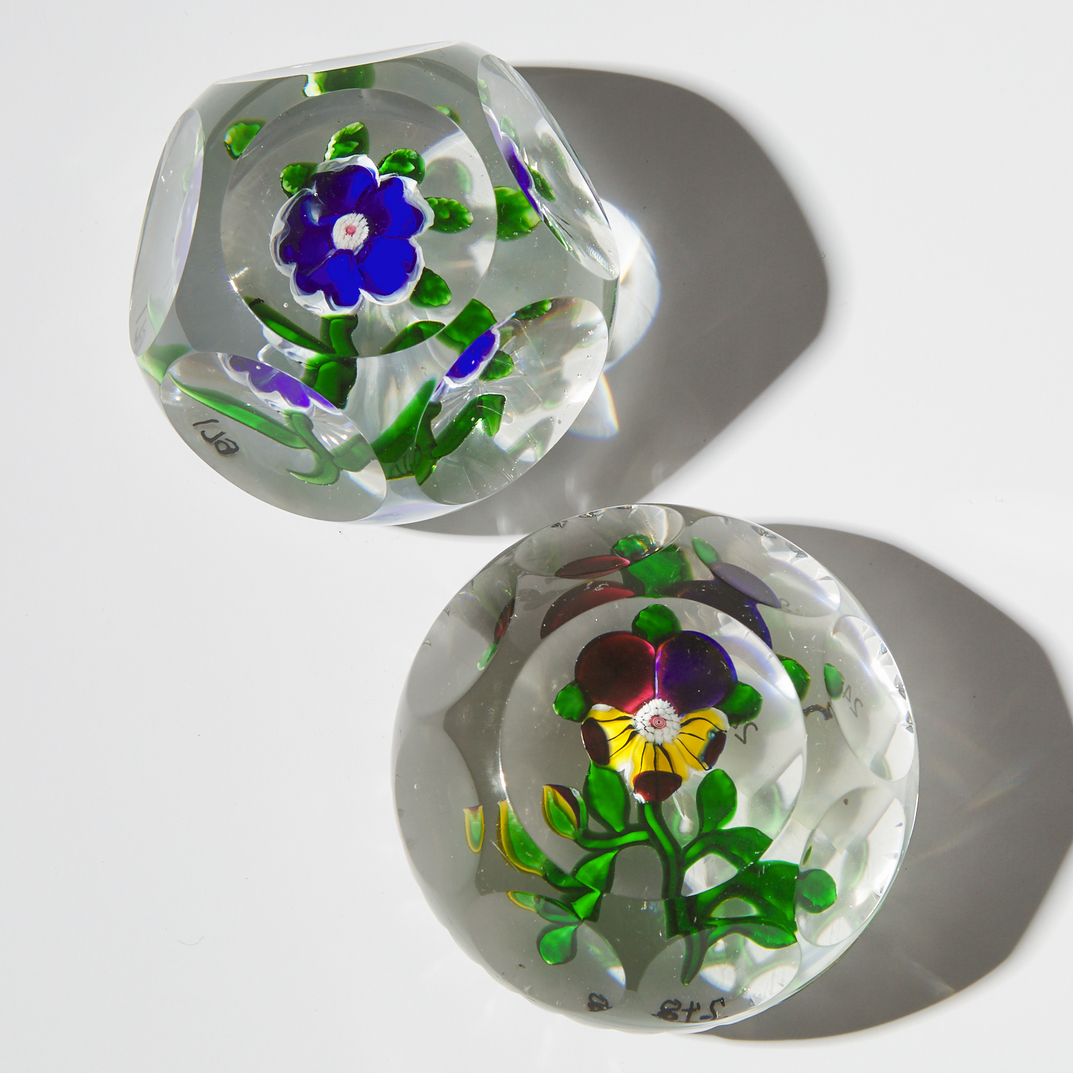 Baccarat Pansy and Blue Primrose Faceted Glass Paperweights, mid-19th century