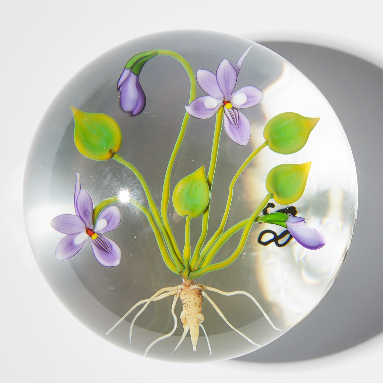 Chris Buzzini (American, b. 1949), Violets Botanical Glass Paperweight, 1988