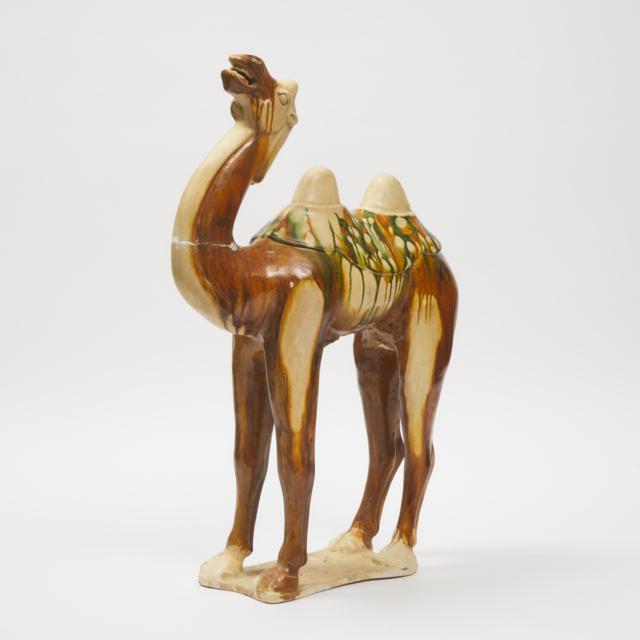 A Large Sancai-Glazed Pottery Figure of a Bactrian Camel, Tang Dynasty (AD 618-907)