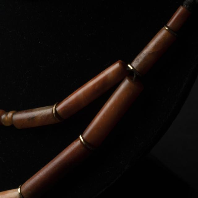A Strand of Ancient Agate and Carnelian Tubular and Beaded Necklace, with Yellow Gold Spacers, Circa 400-800 BC