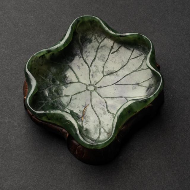 A Spinach Jade Lotus-Form Washer, 19th Century