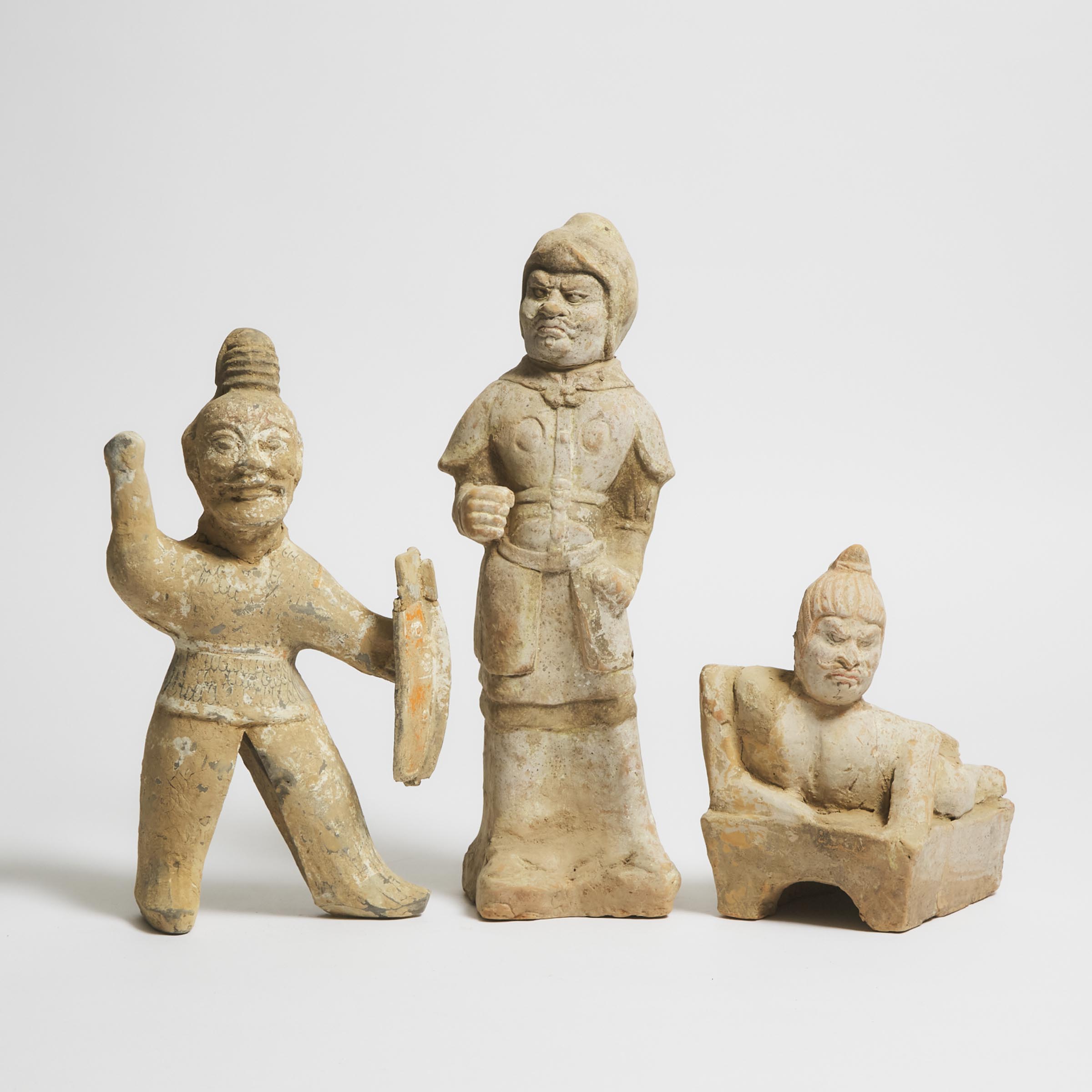 A Group of Three Painted Pottery Figures, Tang Dynasty (AD 618-907)