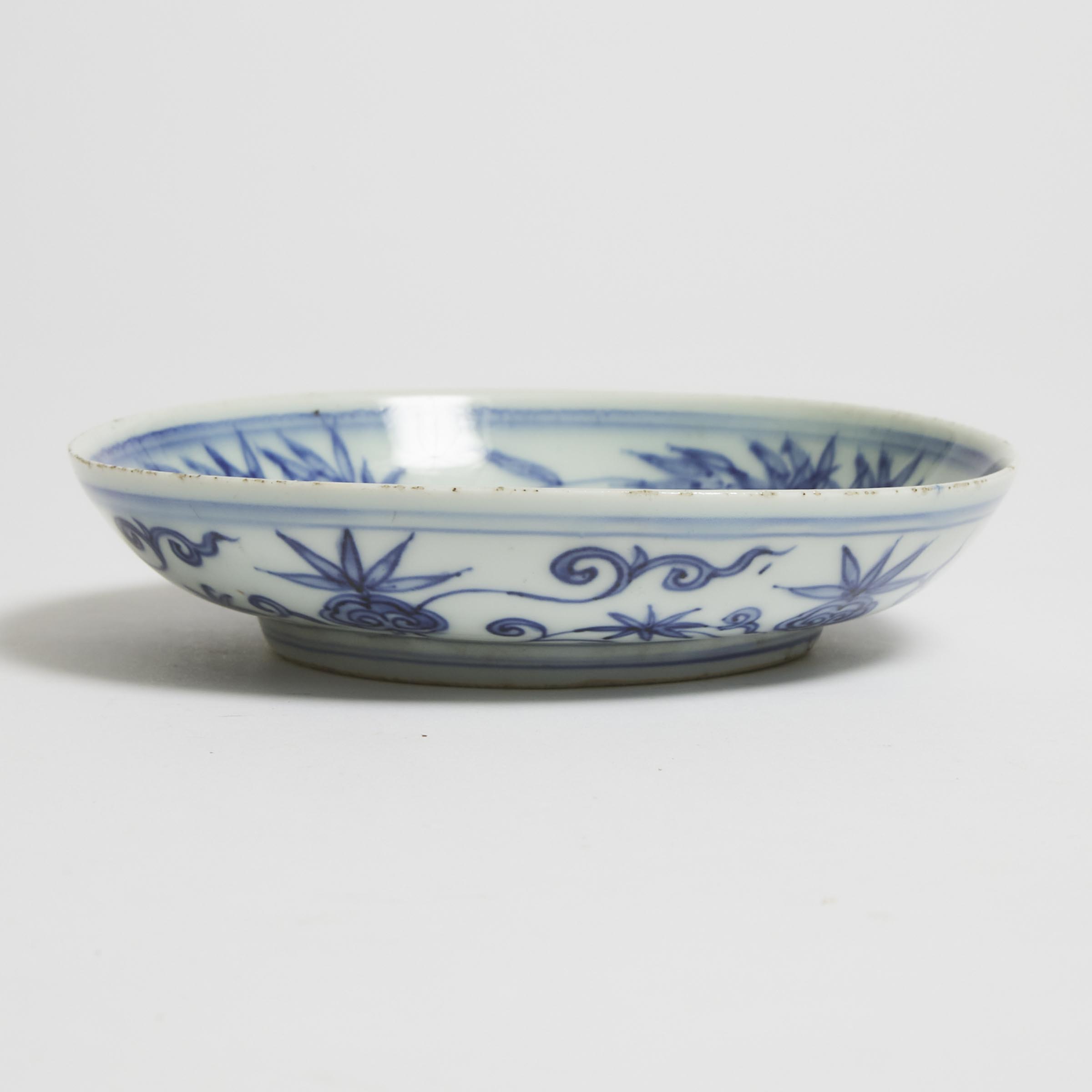 A Blue and White 'Buddhist Lion' Plate, Yong Bao Chang Chun Mark, Wanli Period (1572-1620)