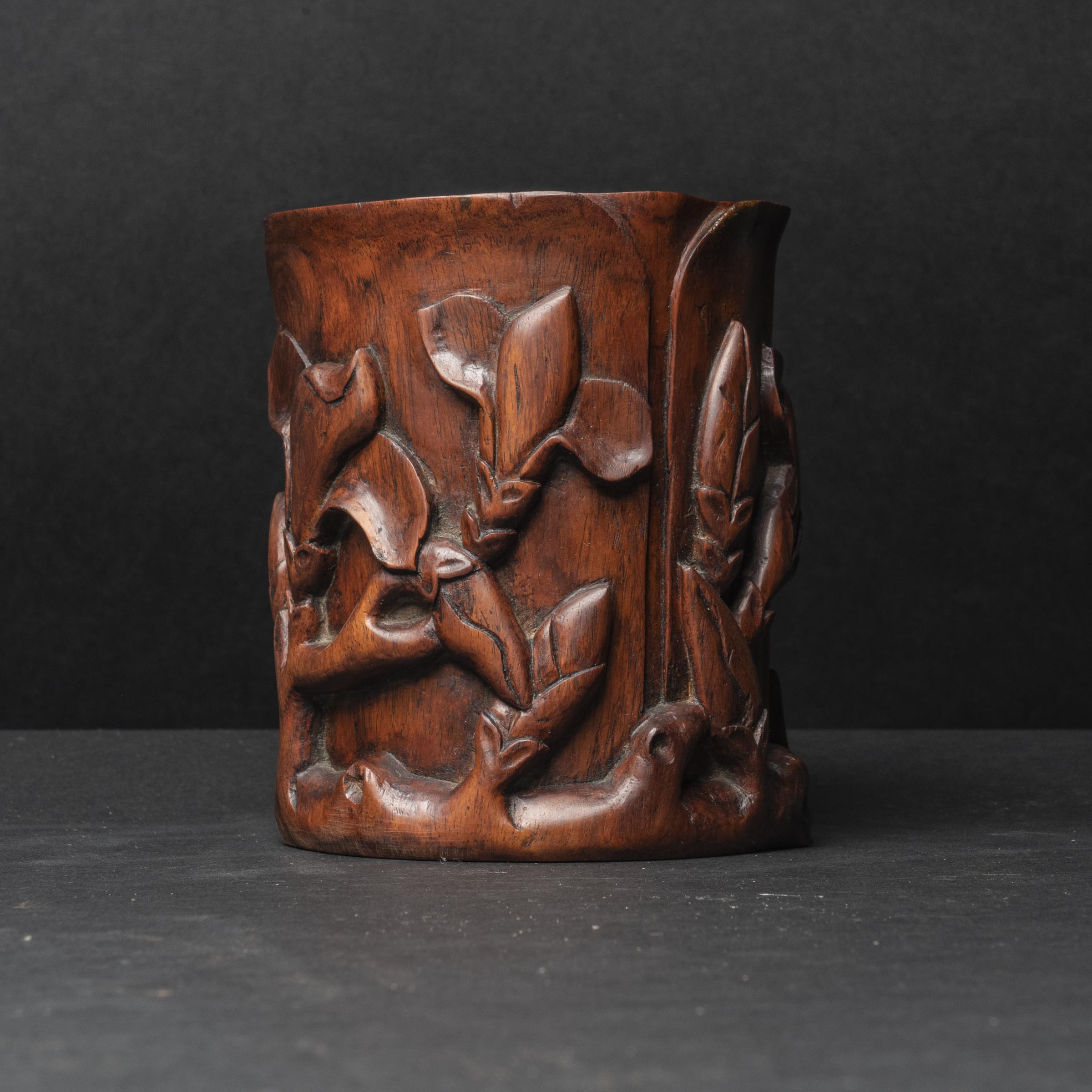 A Carved Huanghuali Orchid-Form Brush Pot, 19th/20th Century