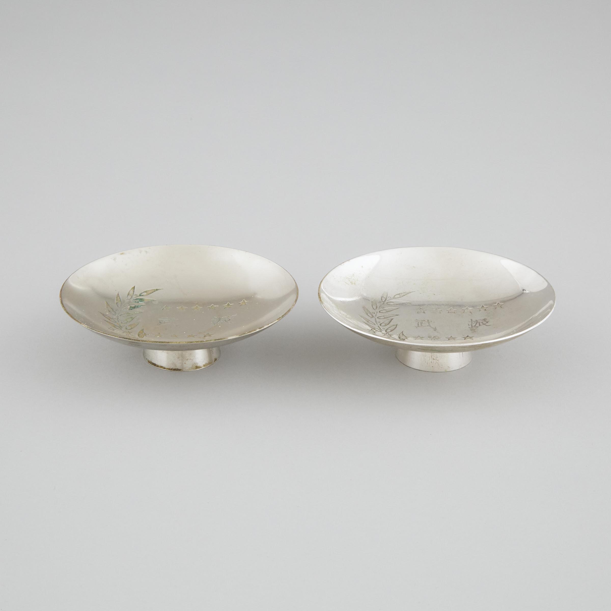 A Pair of Japanese Silver 'Mukden Incident' Triumphal Memorial Sake Cups (Guinomi), Circa 1932