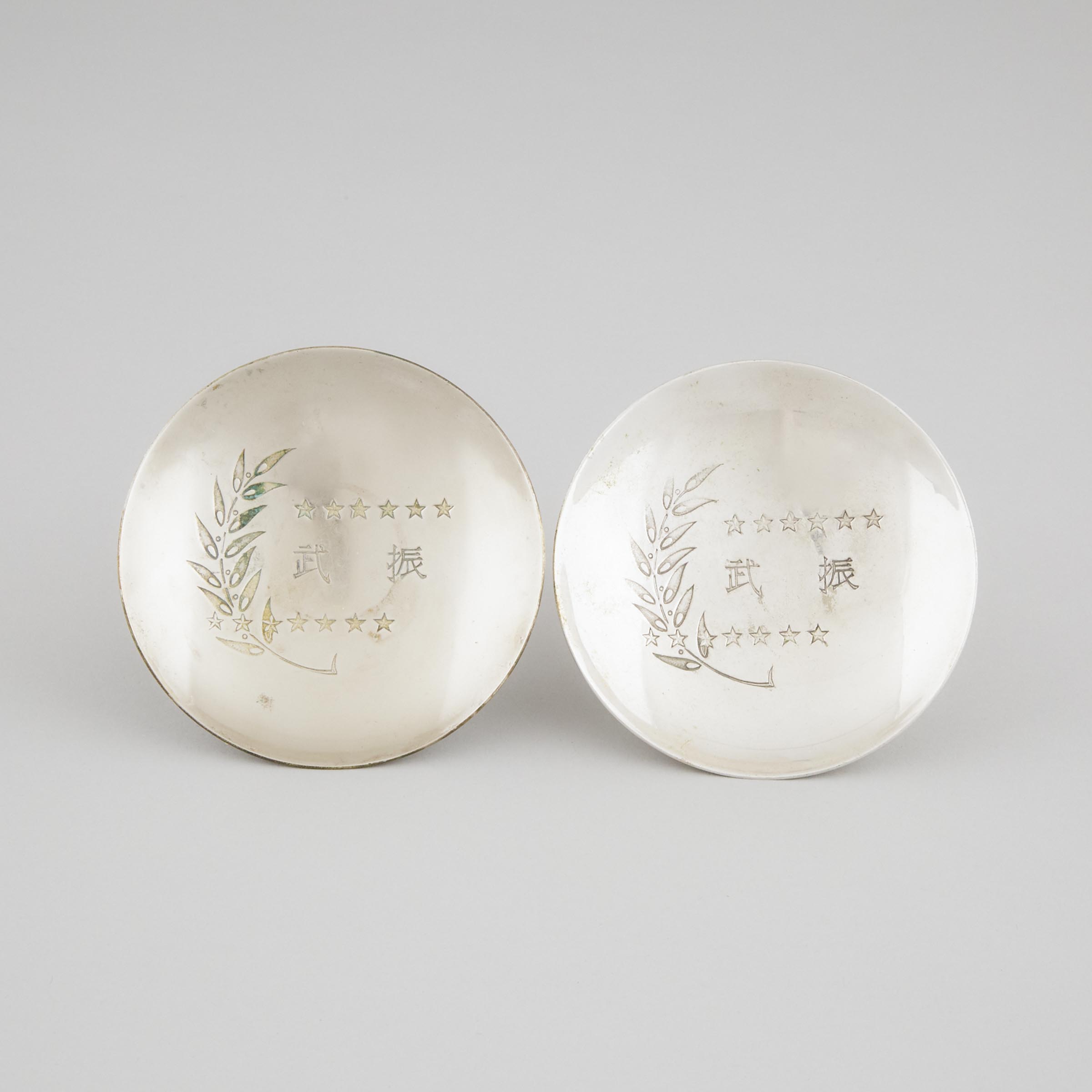 A Pair of Japanese Silver 'Mukden Incident' Triumphal Memorial Sake Cups (Guinomi), Circa 1932