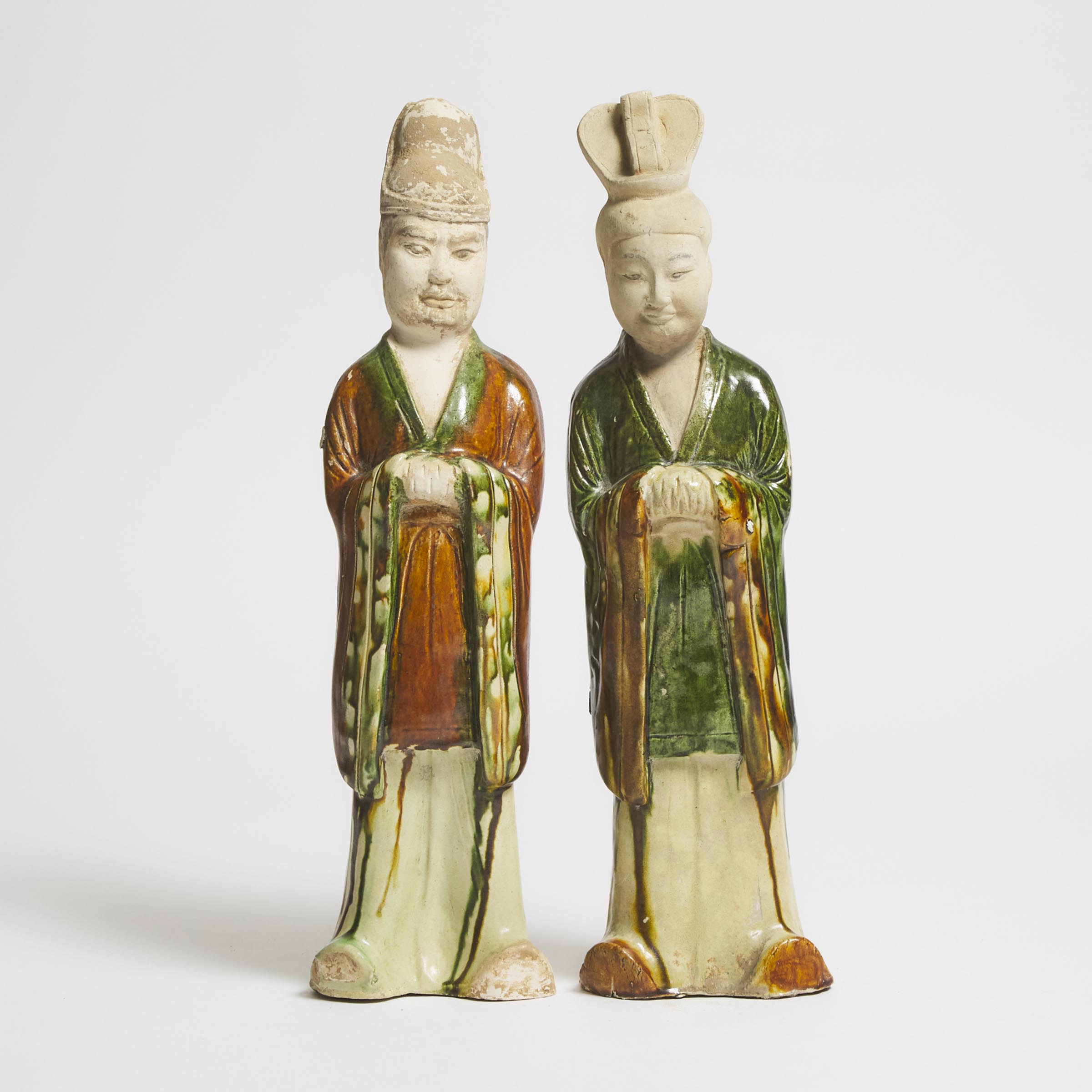 A Pair of Sancai-Glazed Pottery Figures of Attendants, Tang Dynasty (AD 618-907)