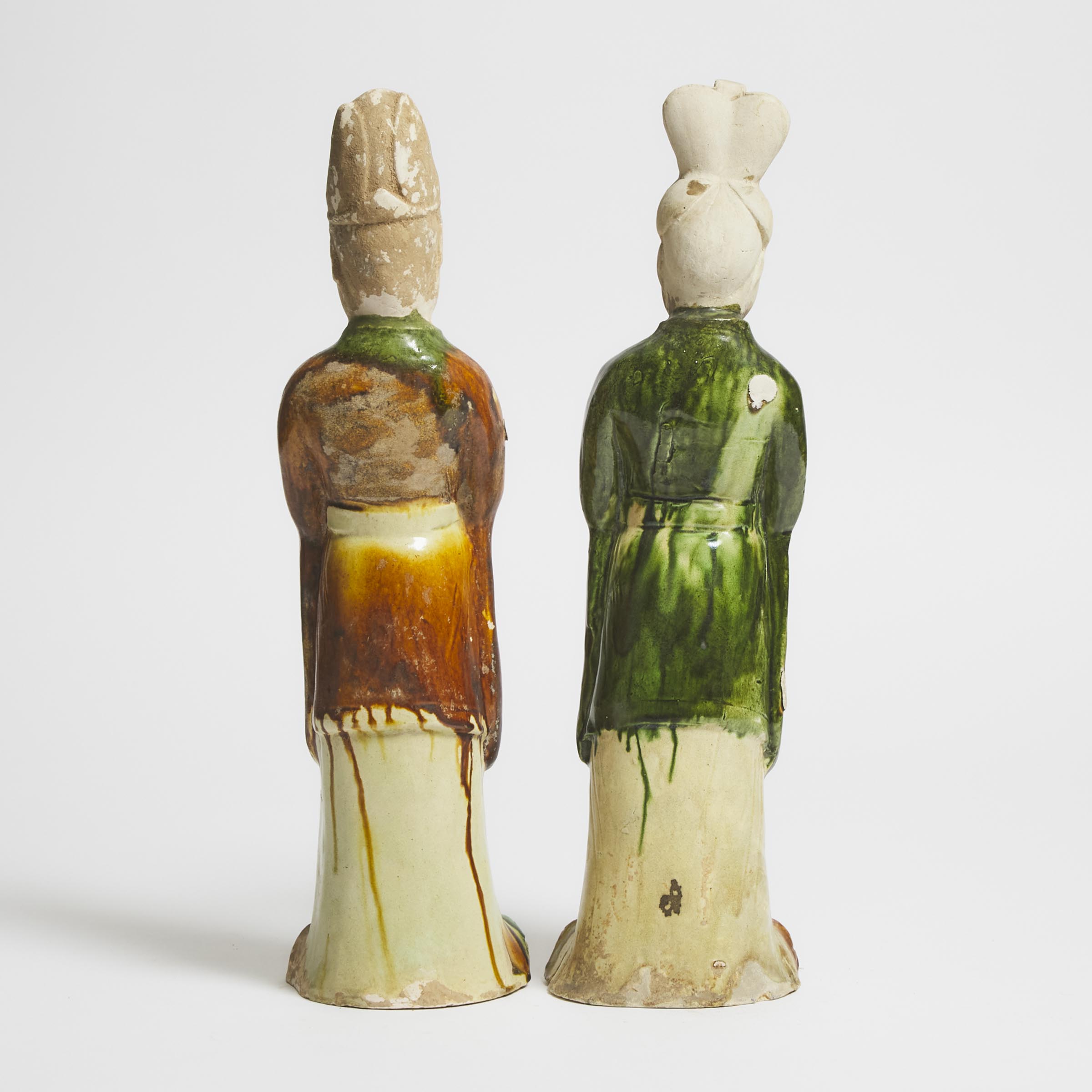 A Pair of Sancai-Glazed Pottery Figures of Attendants, Tang Dynasty (AD 618-907)