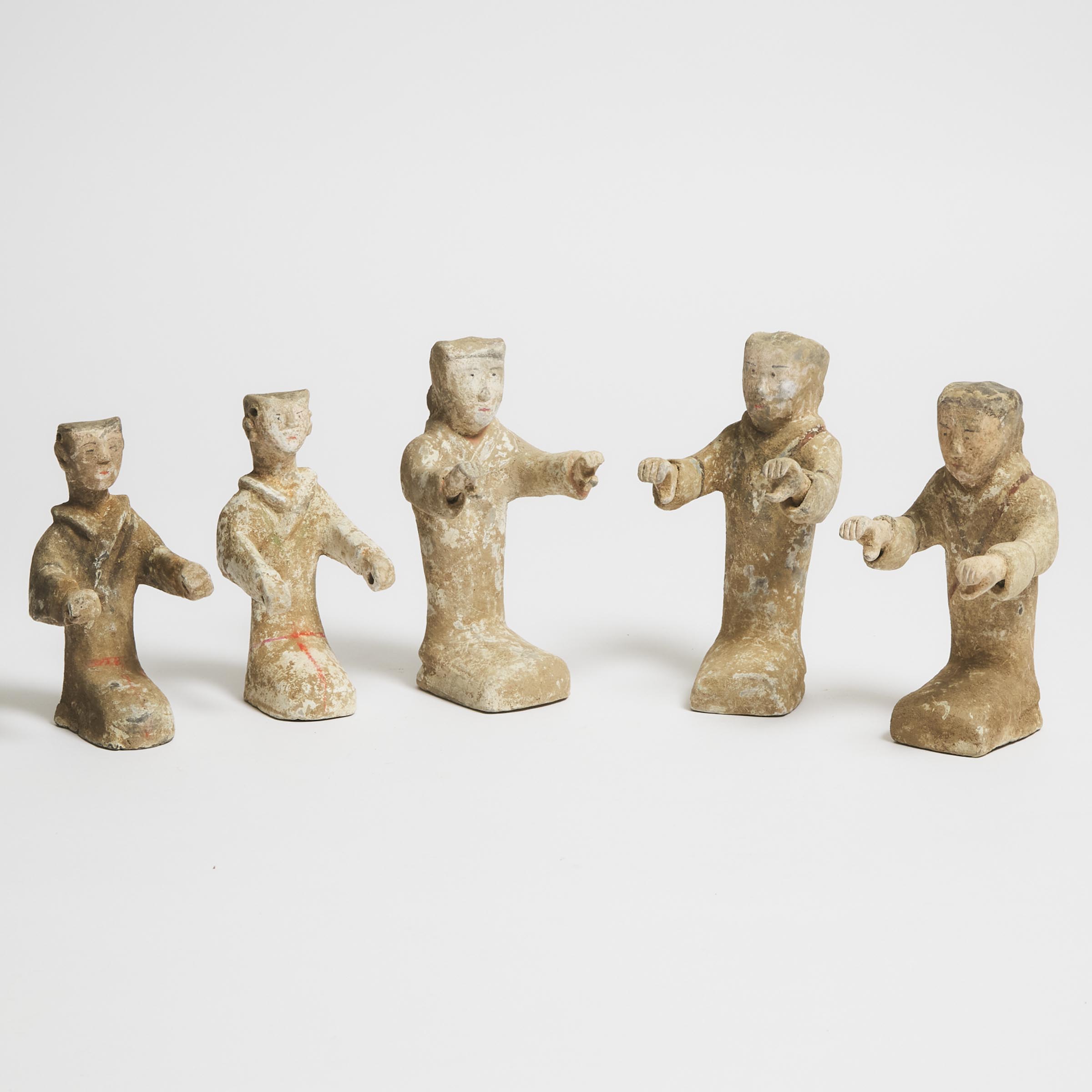 A Group of Five Painted Pottery Kneeling Figures, Han Dynasty (206 BC-AD 220)