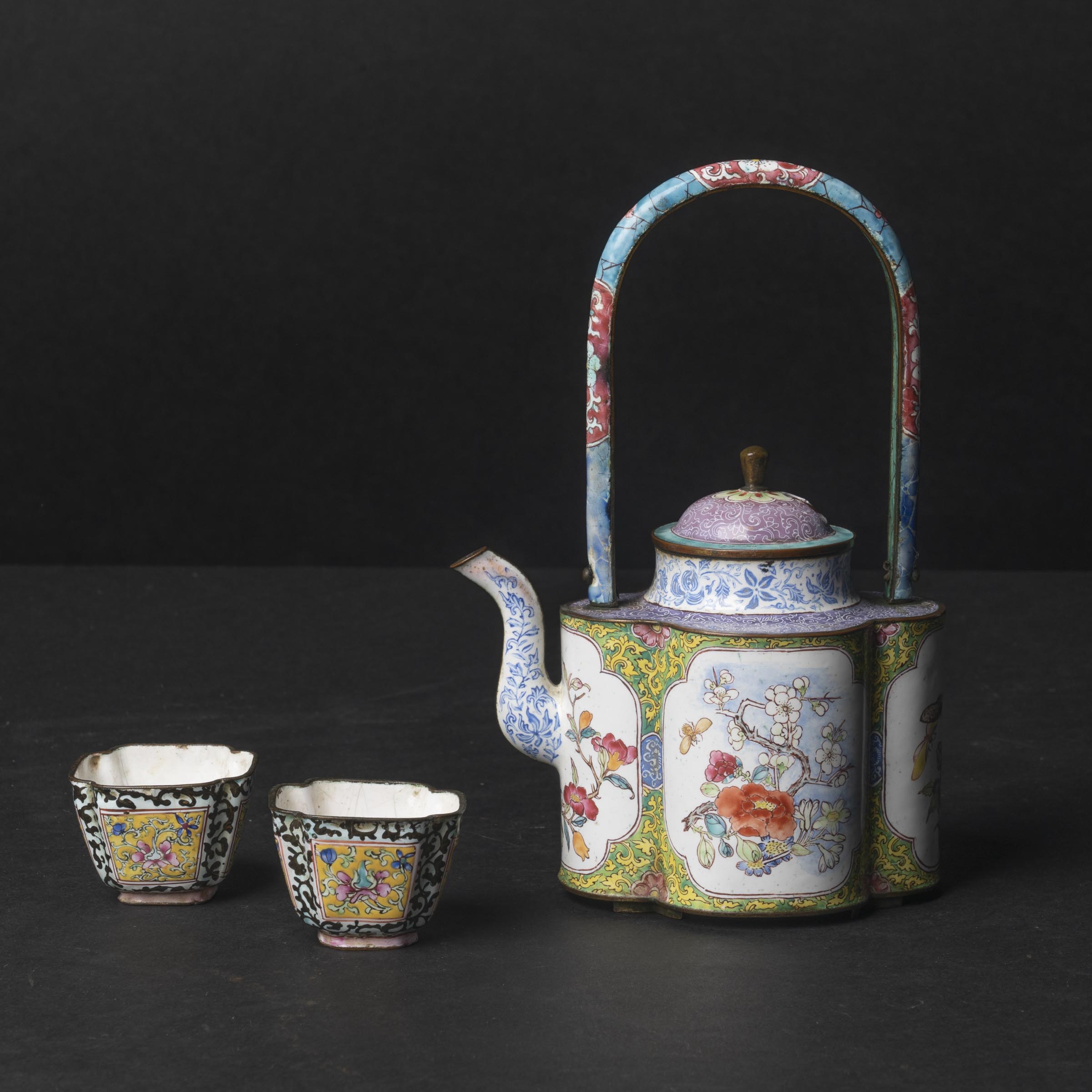 A Set of Two Canton Enamel Cups and Teapot, 18th/19th Century