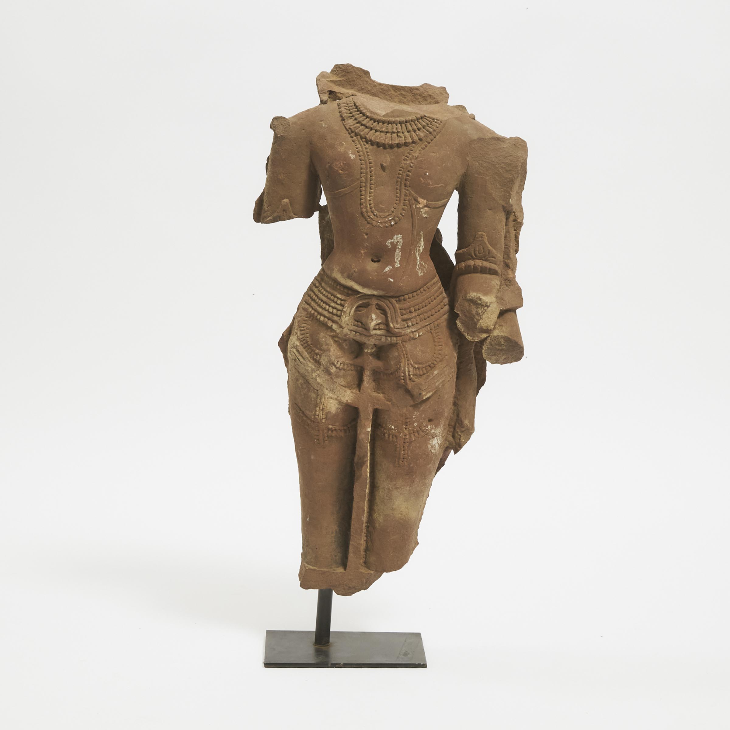 A Large Stone Torso of a Male Deity, India, 12th Century or Later