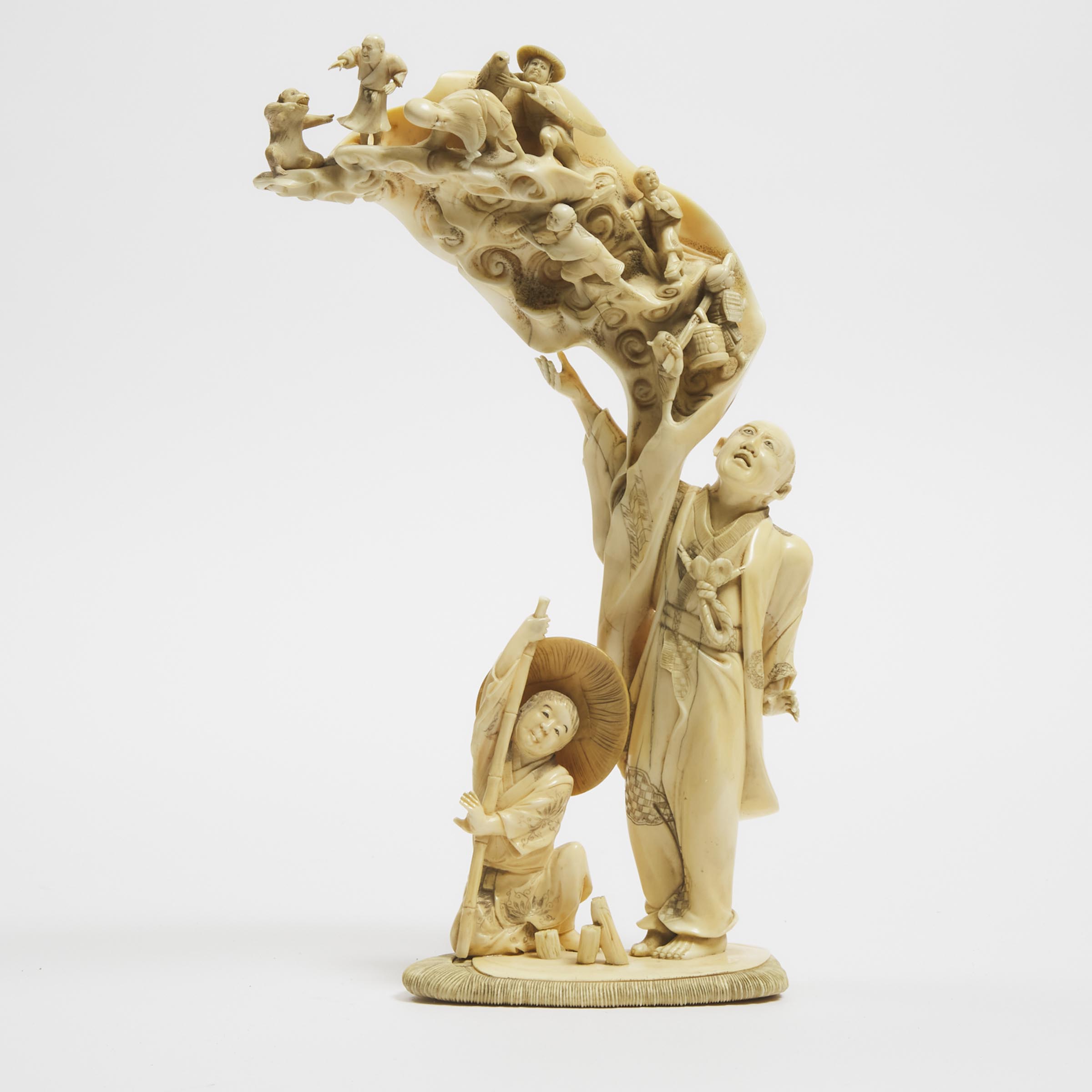An Ivory Okimono Group of a Dream Sequence, Signed Dogetsu, Meiji Period (1868-1912)