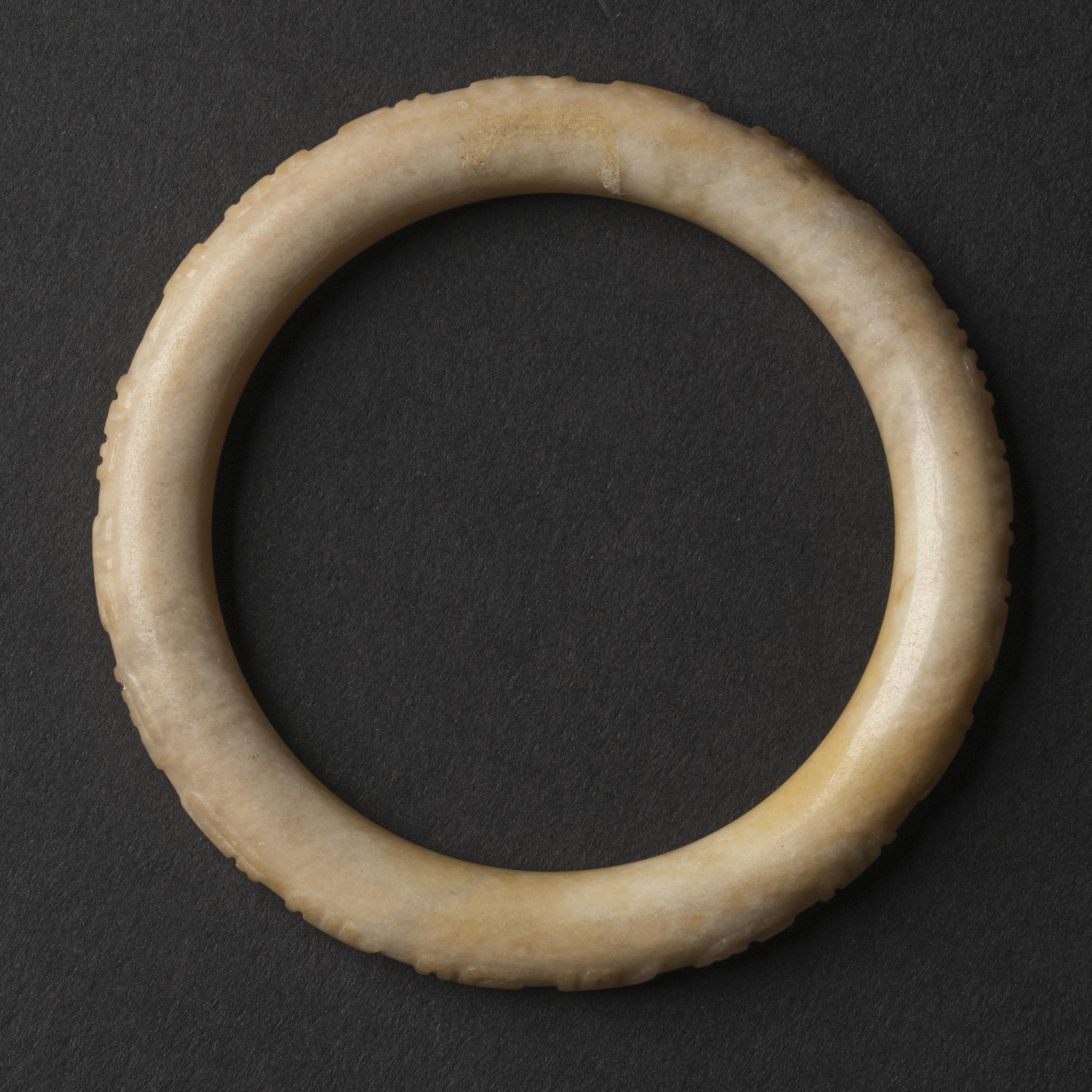 A White Jade Bangle with Inscription, Ming Dynasty (1368-1644)