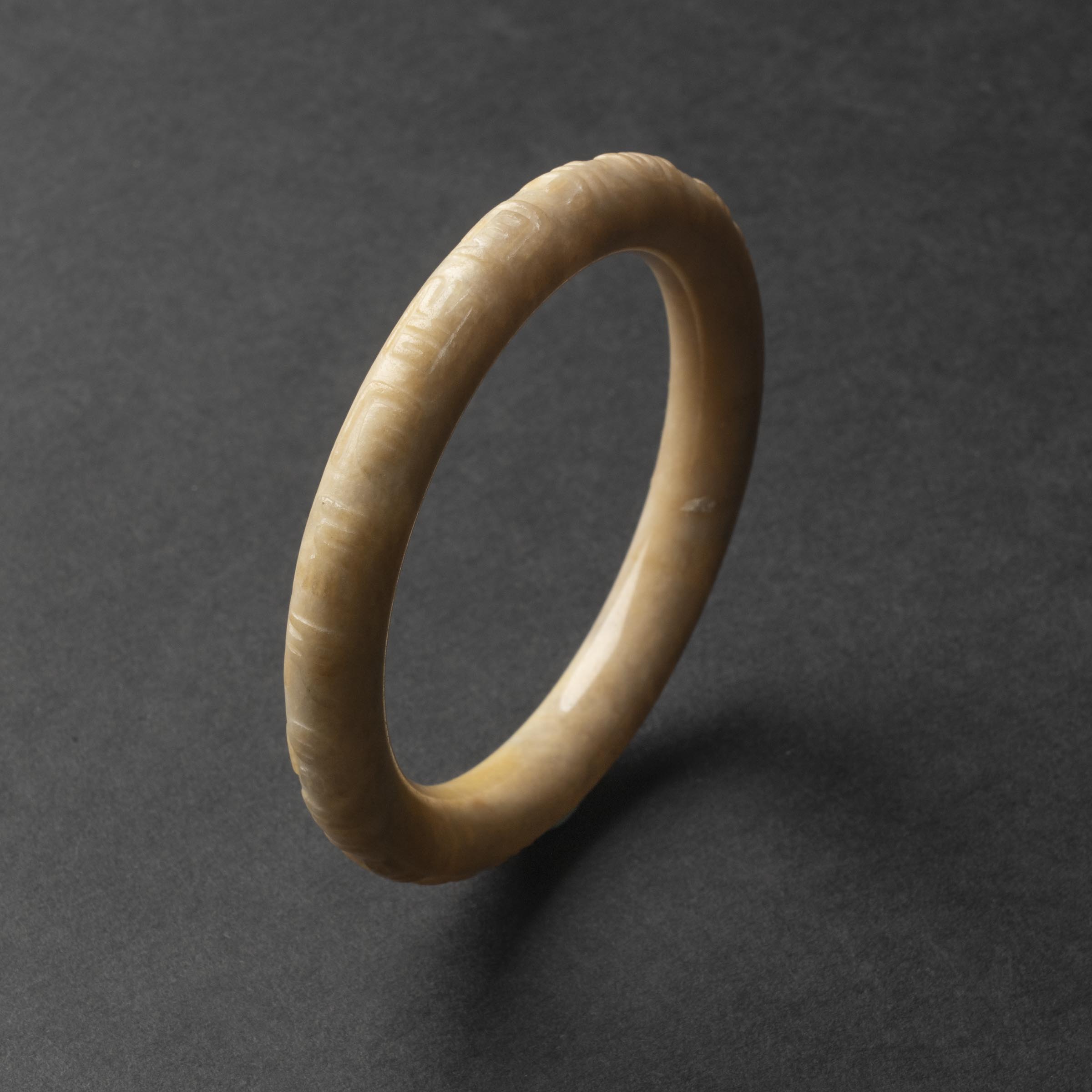 A White Jade Bangle with Inscription, Ming Dynasty (1368-1644)