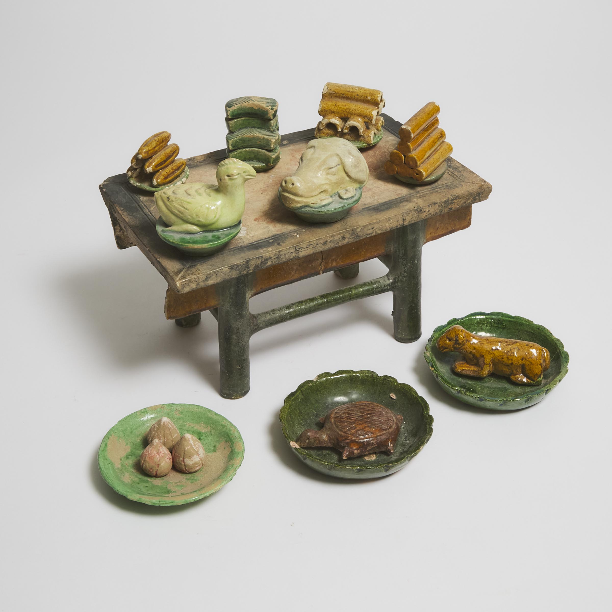 A Set of Ten Sancai-Glazed Pottery Food Offerings and Table, Ming Dynasty (1368-1644)