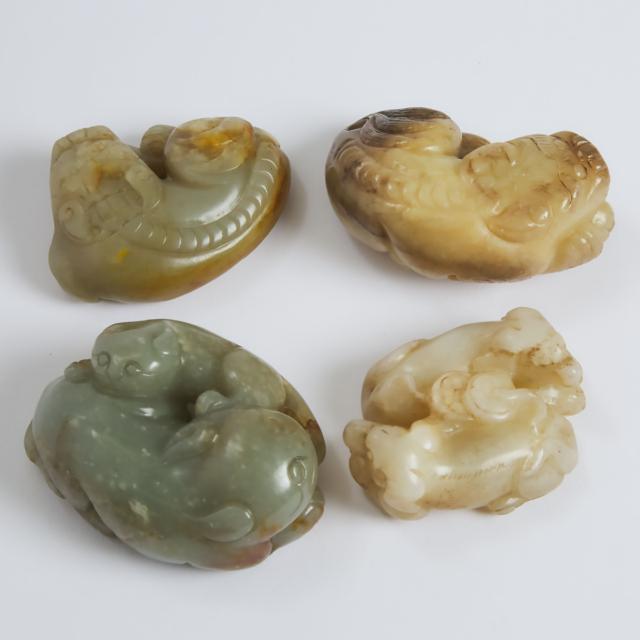A Group of Four White and Celadon Jade Carvings of Mythical Beasts