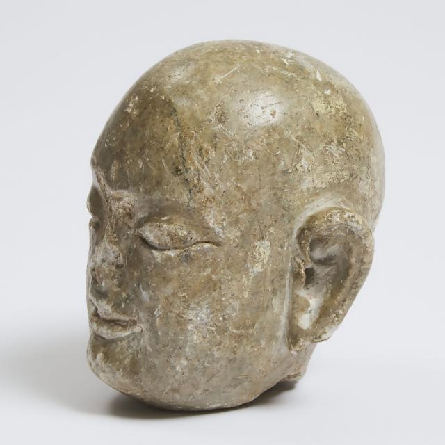 A Tang-Style Carved Limestone Head of a Monk