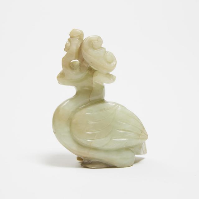 A White and Russet Jade Carving of a Phoenix Holding Lingzhi, Qing Dynasty, 19th Century