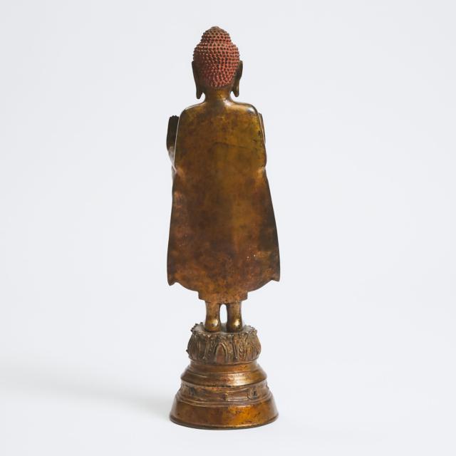 A Burmese Gilt Bronze Figure of a Standing Buddha, 18th/19th Century