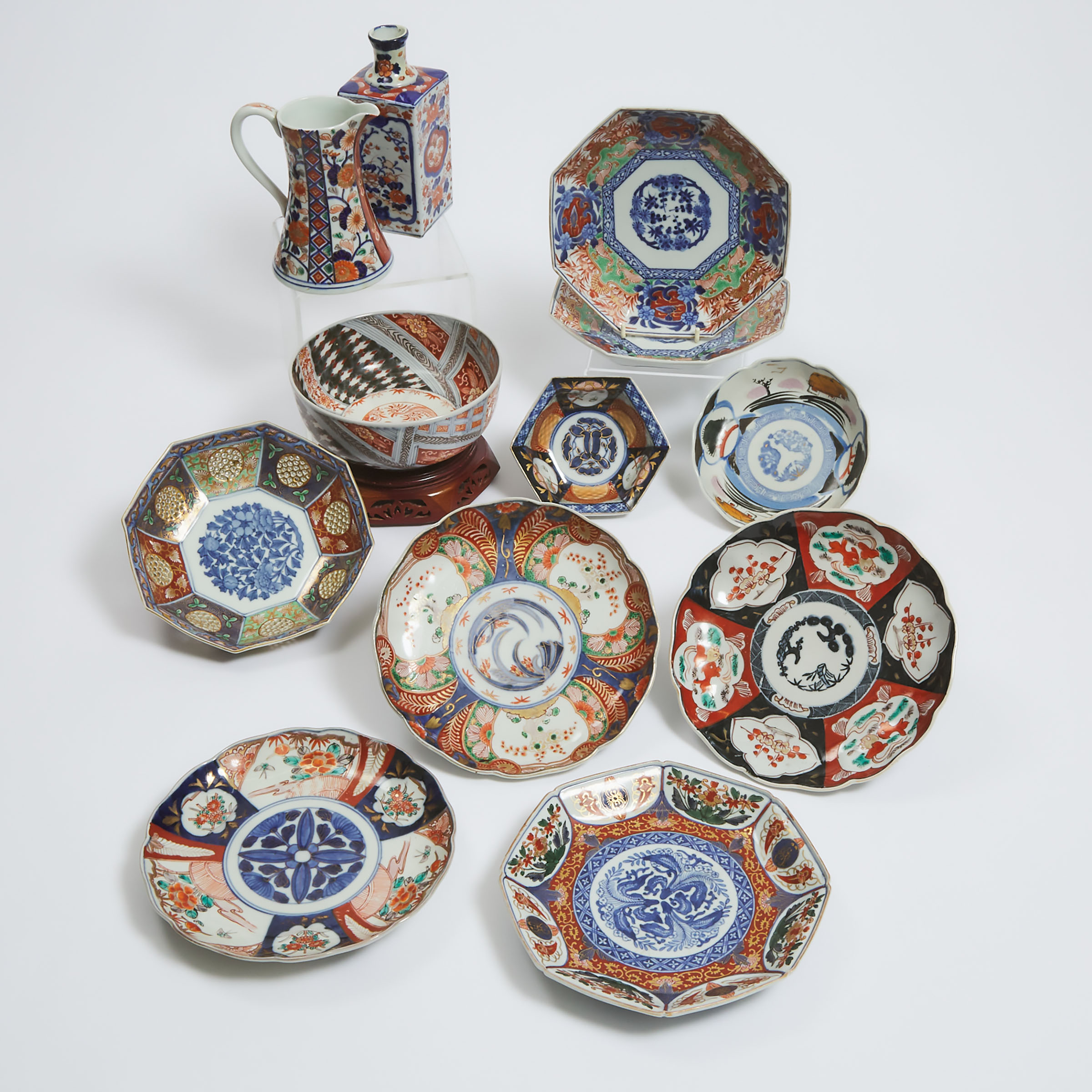 A Group of Twelve Imari Porcelain Wares, Meiji Period