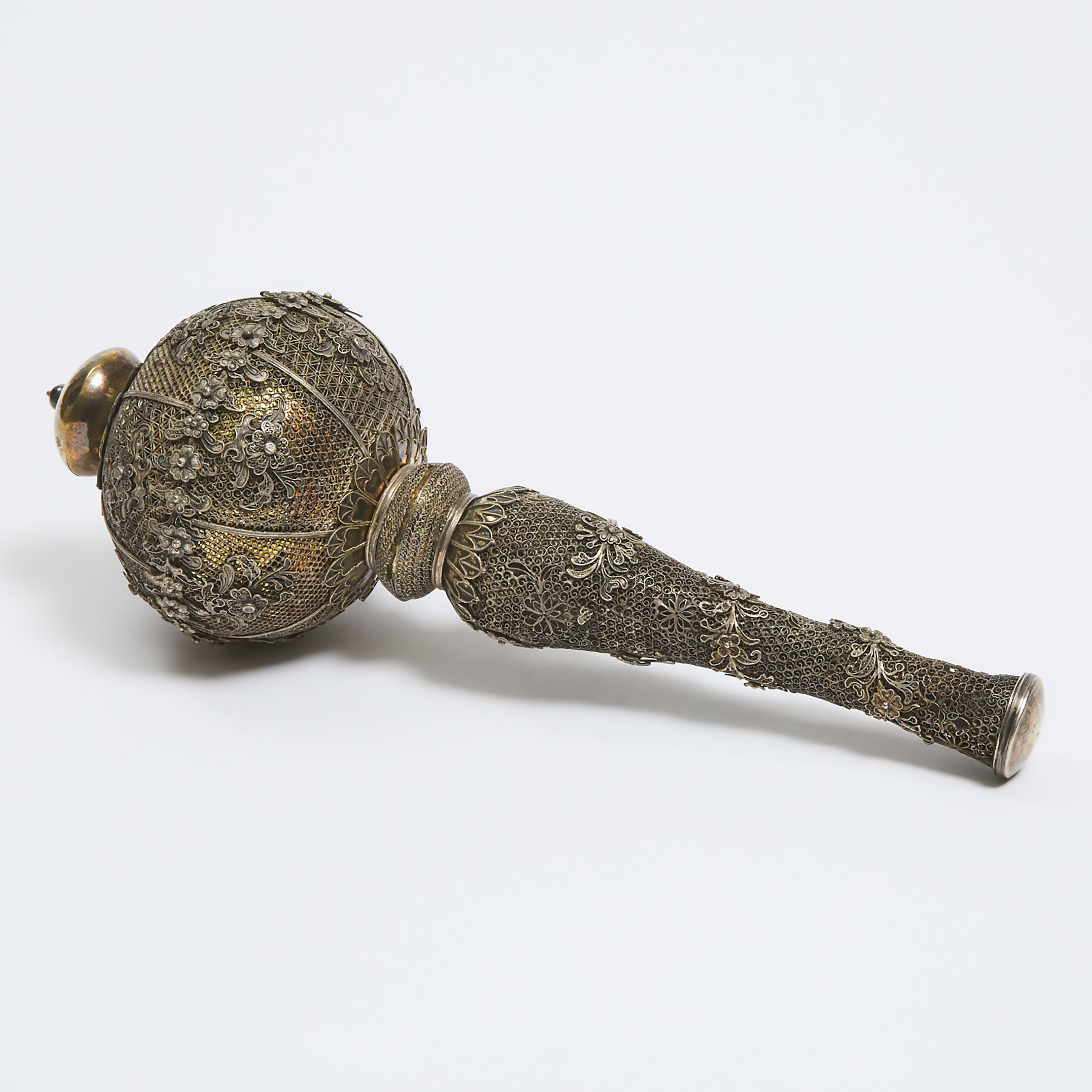 A Silver and Brass Filigree Children's Toy, Late 19th Century