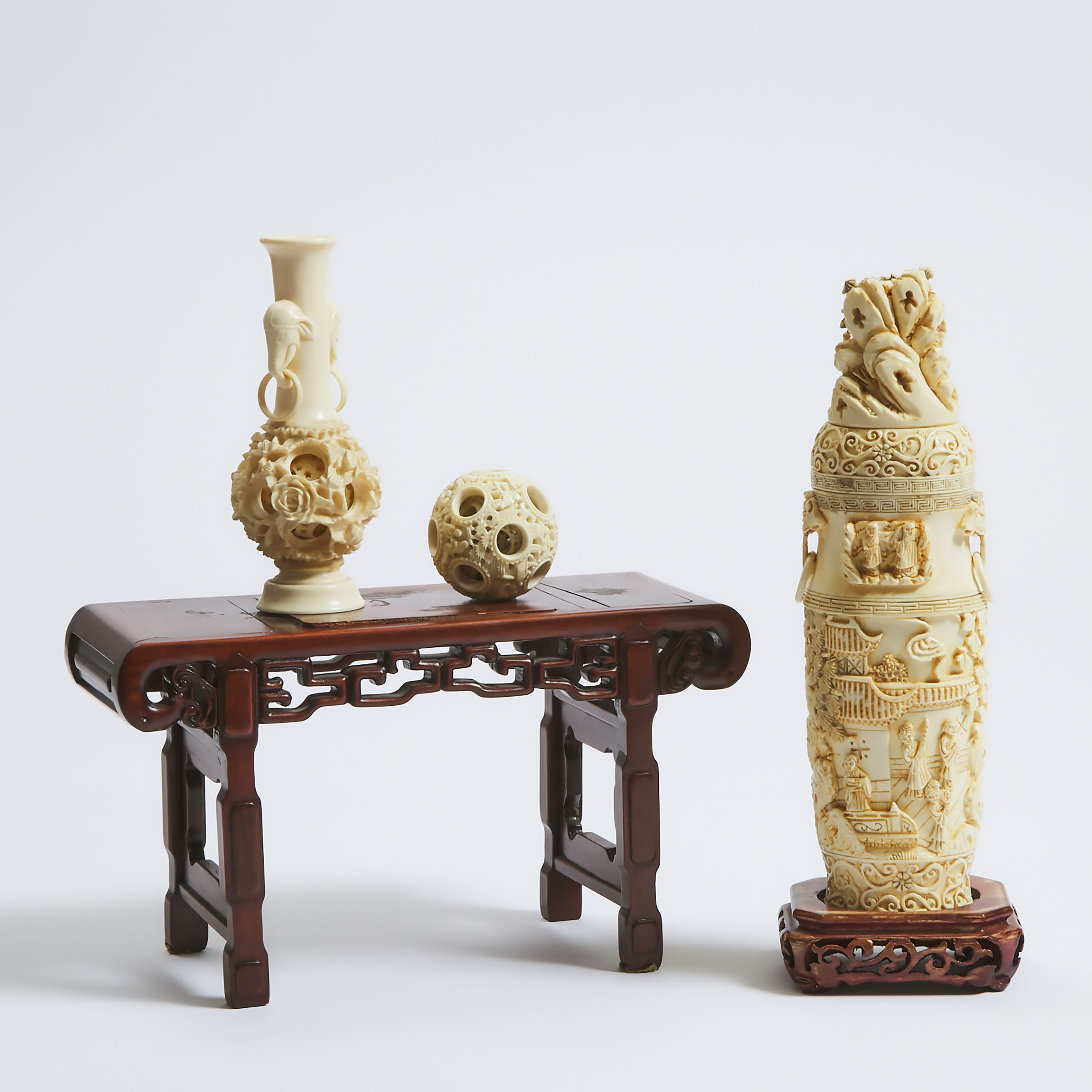 A Chinese Ivory Vase and Cover, Together With a Puzzle Ball Vase, Puzzle Ball, and Miniature Wood Table, Early to Mid 20th Century