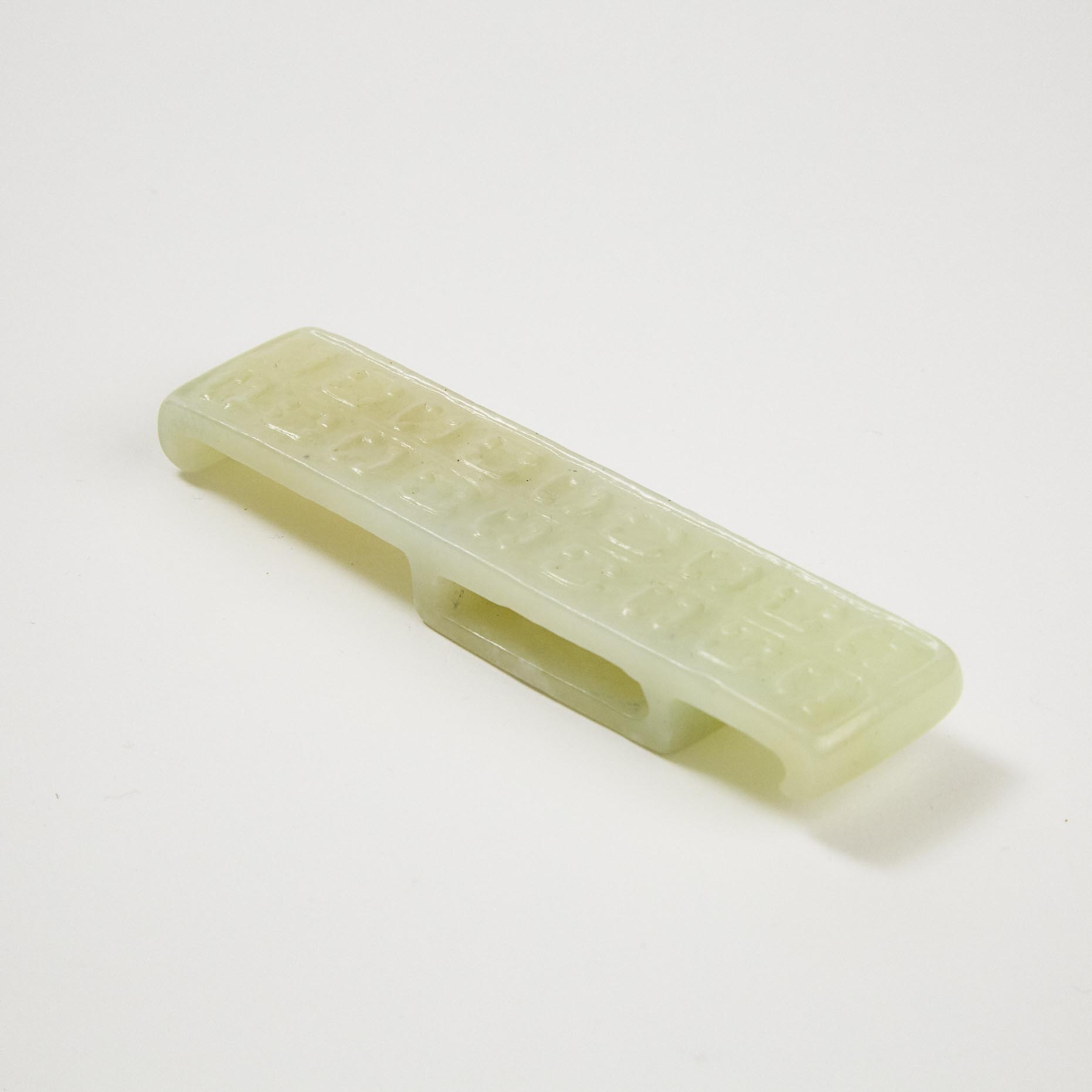 A White Jade Scabbard Slide, Ming Dynasty or Earlier