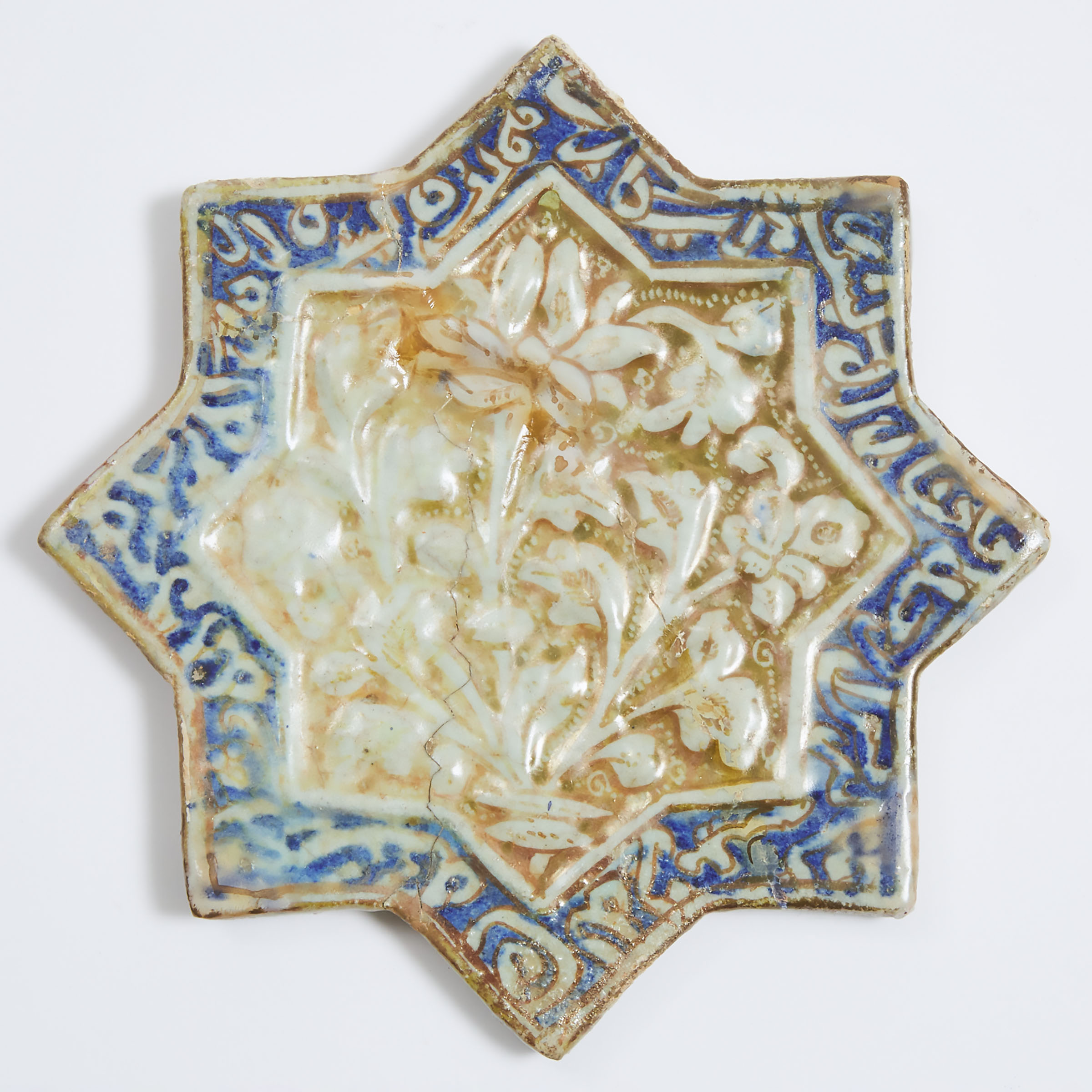 A Central Iranian Kashan Lustre Pottery Star Tile, 13th/14th Century