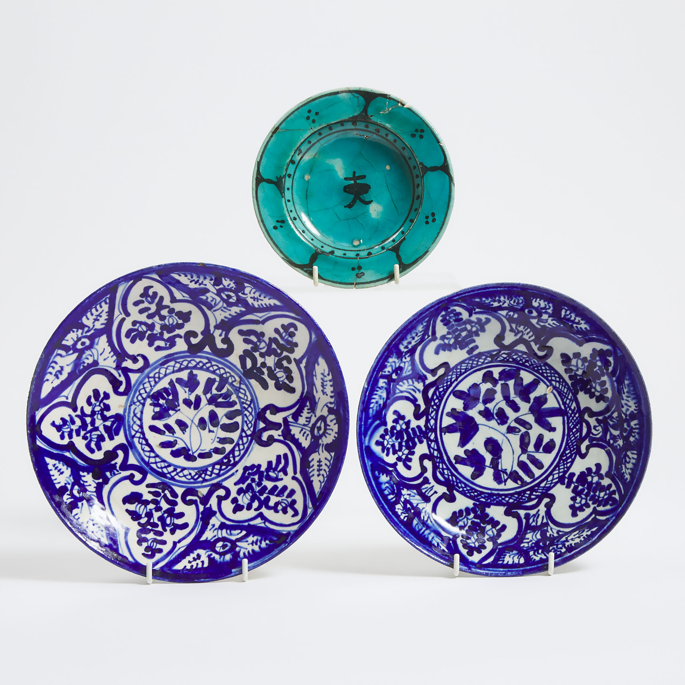 A Syrian Turquoise Glazed Shallow Bowl, 17th Century, Together with Two Persian Blue and White Plates, 19th Century