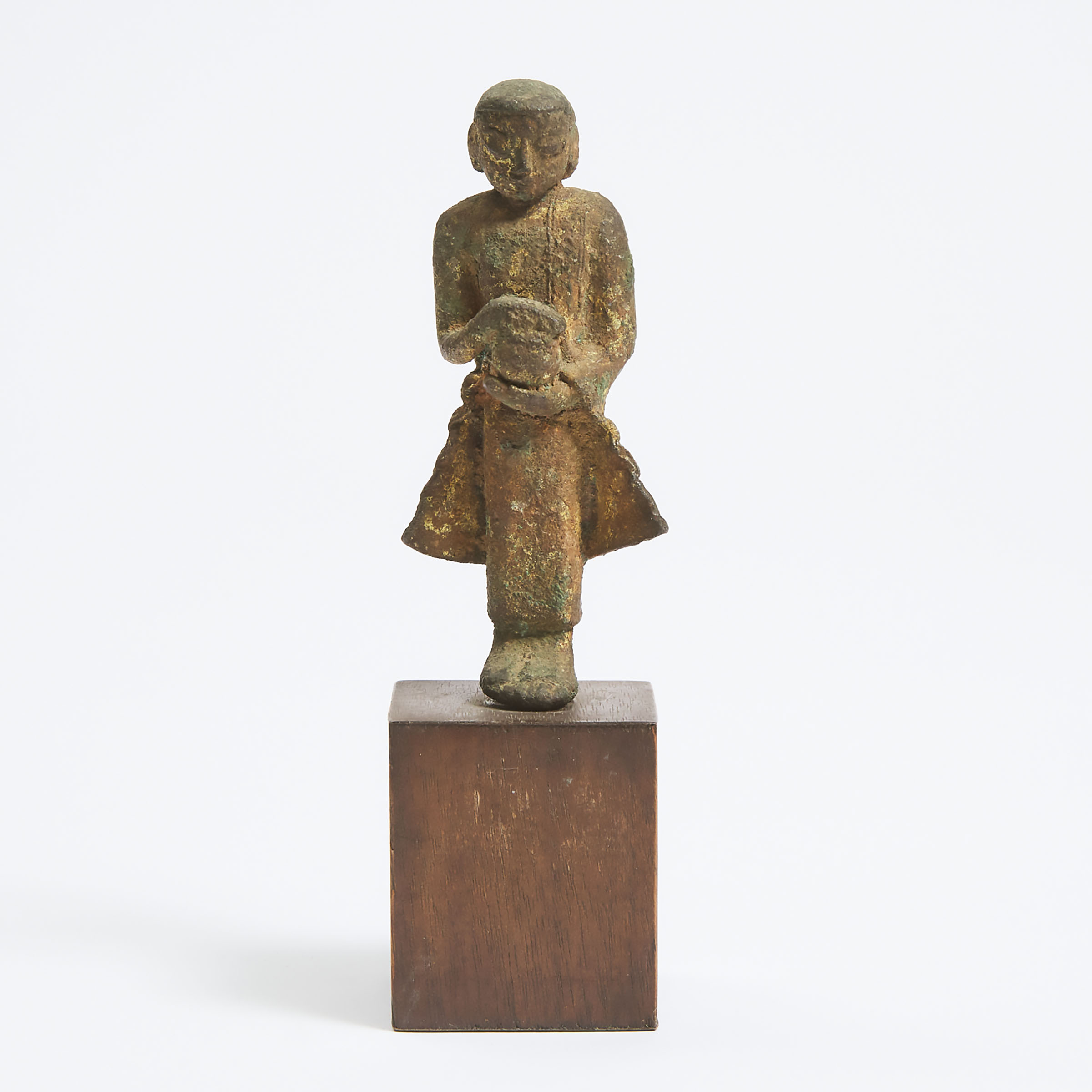 A Small Burmese Gilt Bronze Figure of a Monk Holding a Vase, 14th Century or Later