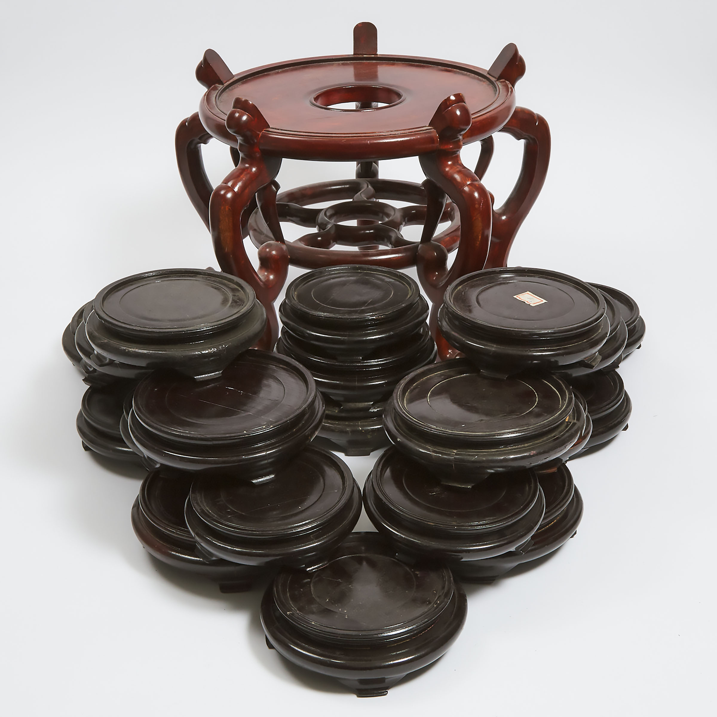 A Group of Twenty-Three Large Chinese Wood Stands