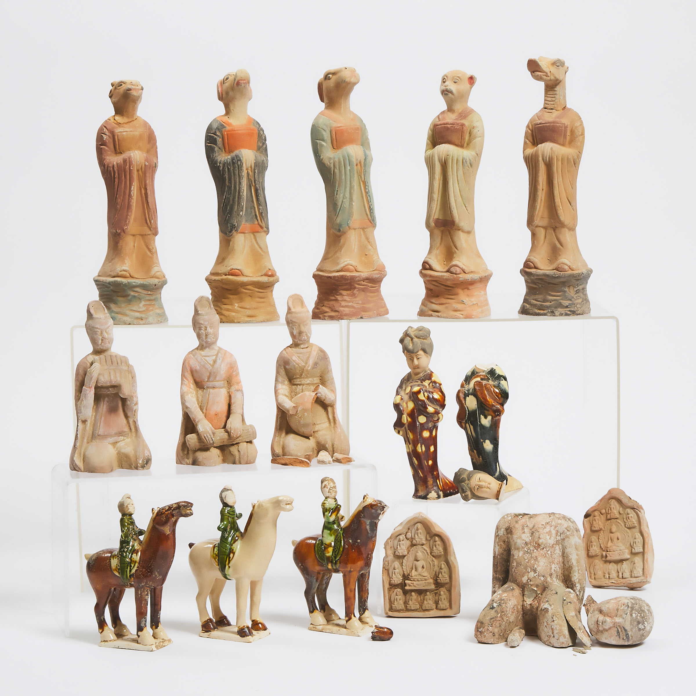 A Group of Sixteen Tang-Style Pottery Figures and Plaques