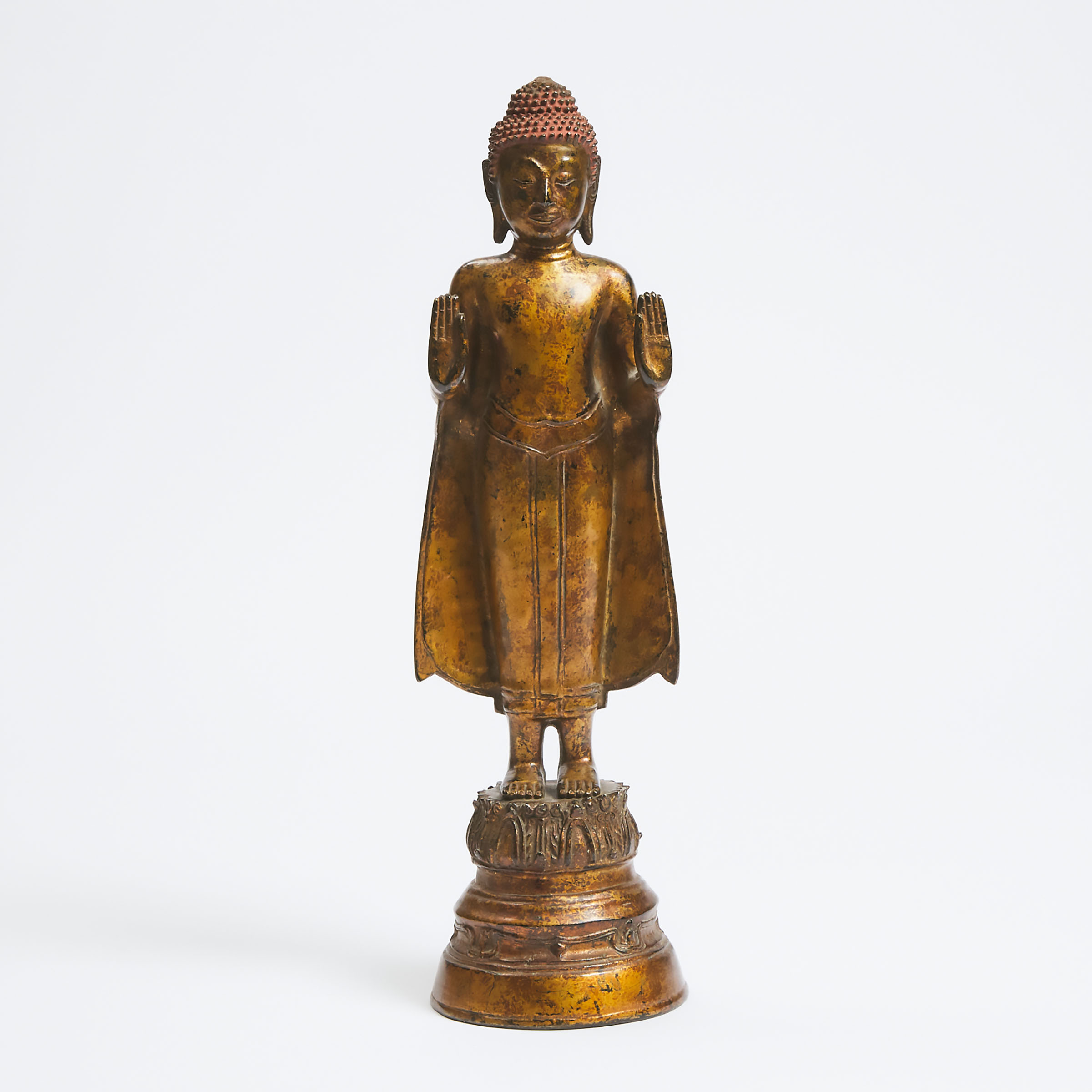 A Burmese Gilt Bronze Figure of a Standing Buddha, 18th/19th Century