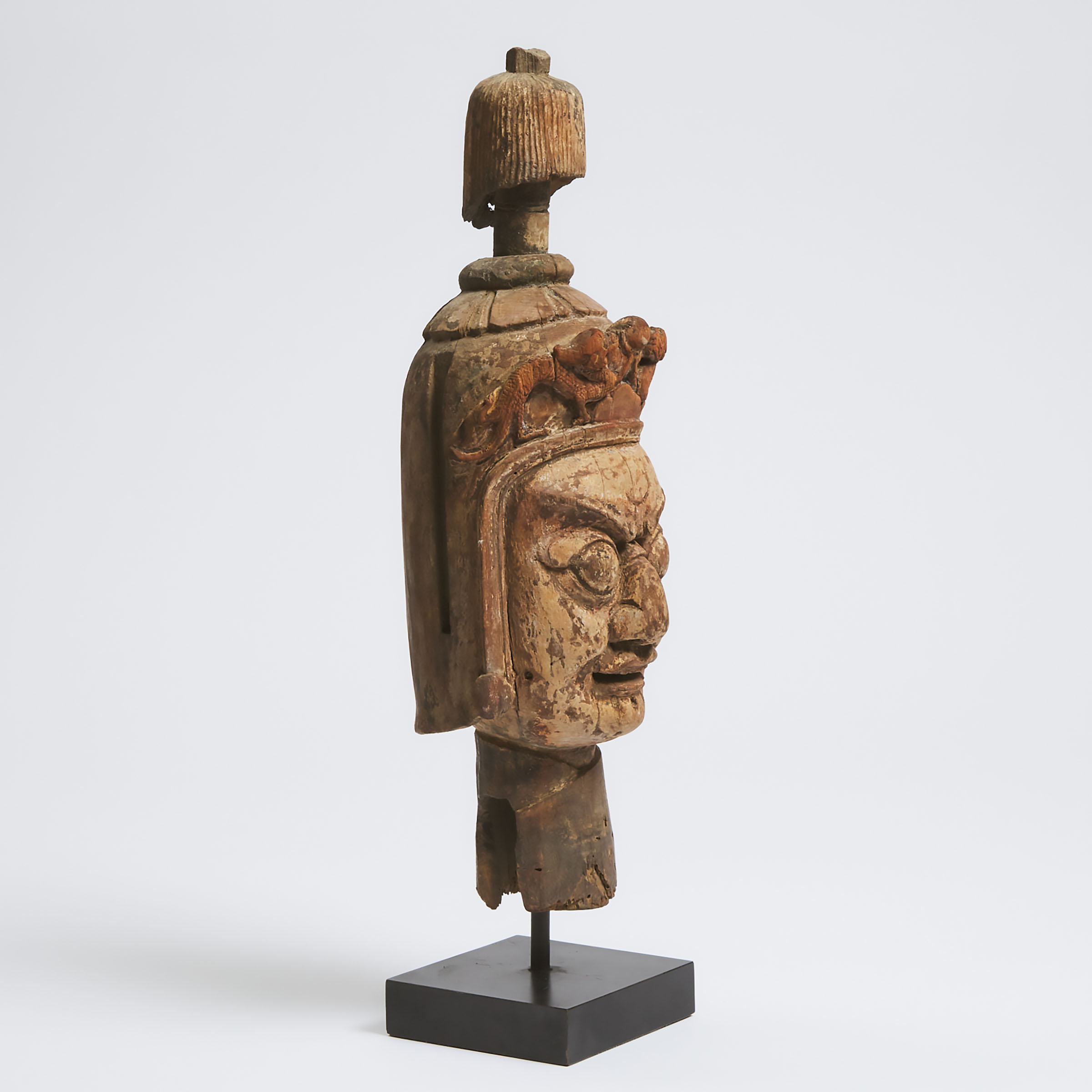 A Sino-Tibetan Carved Wood Head of a Guardian, Ming Dynasty