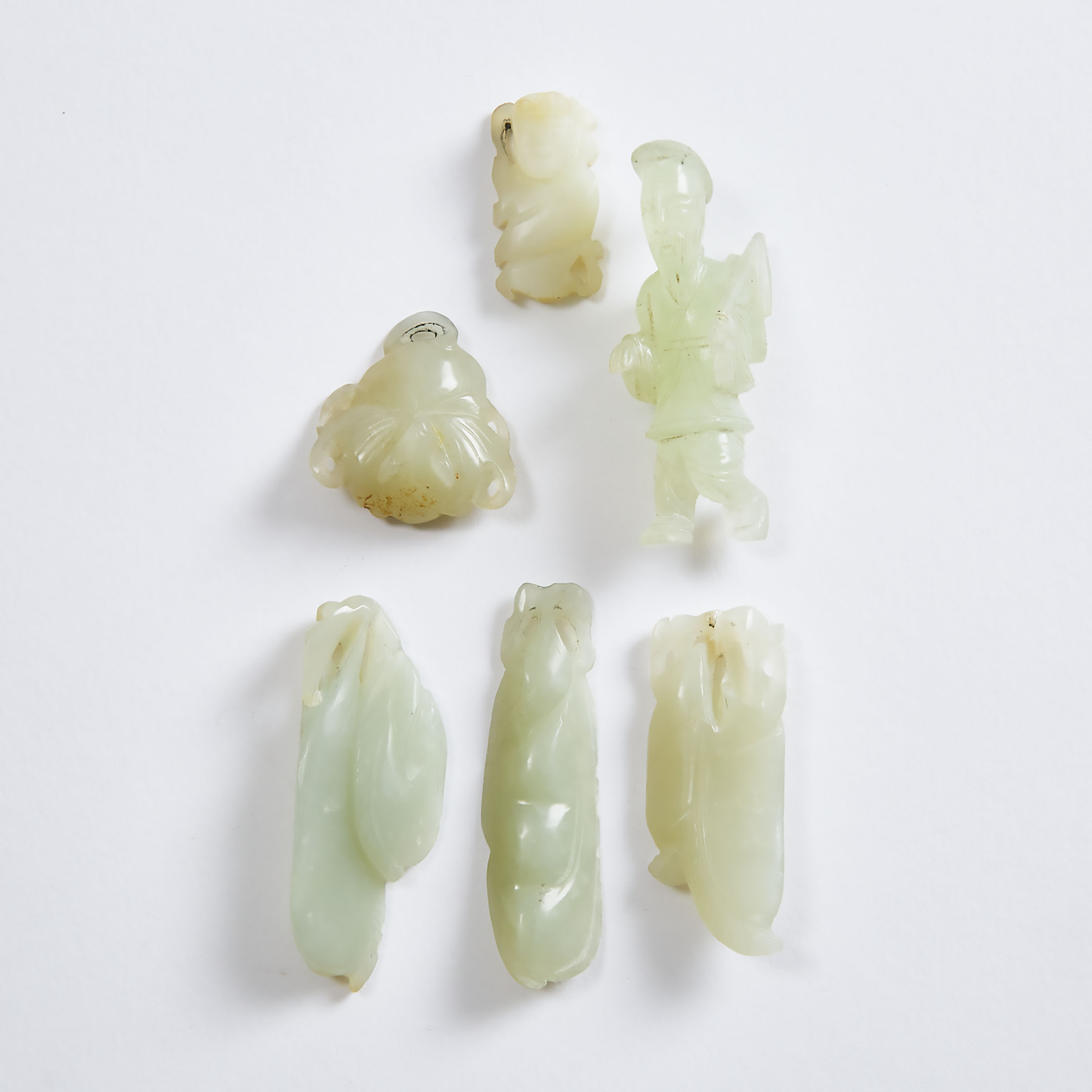 A Group of Six White and Pale Celadon Jade Carvings, Qing Dynasty