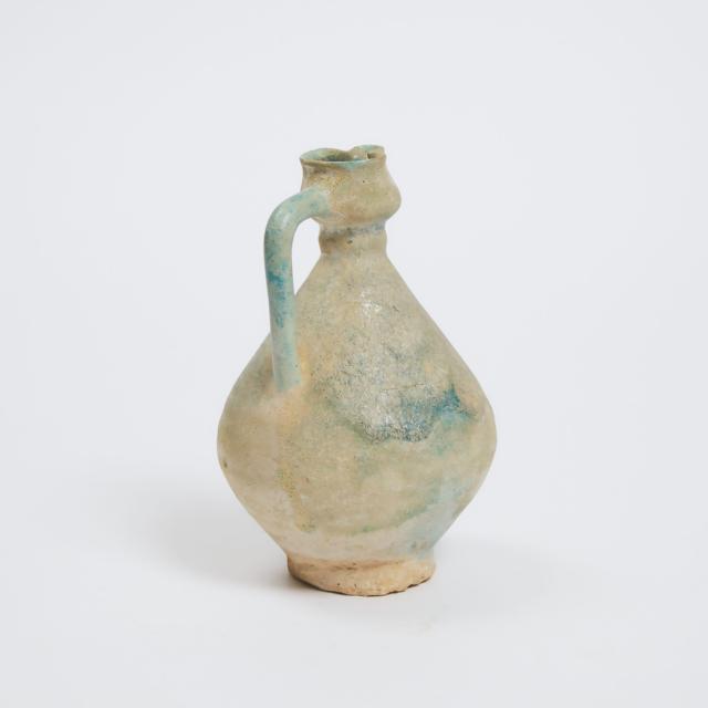 A Nishapur Turquoise-Glazed Pottery Jug, Iran, 12th/13th Century