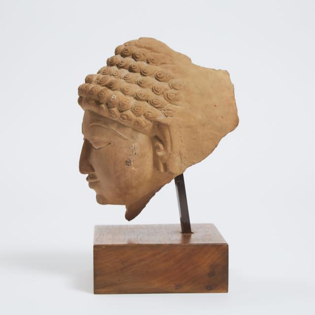 A Jain Sandstone Head of a Jina, Central India, 10th Century