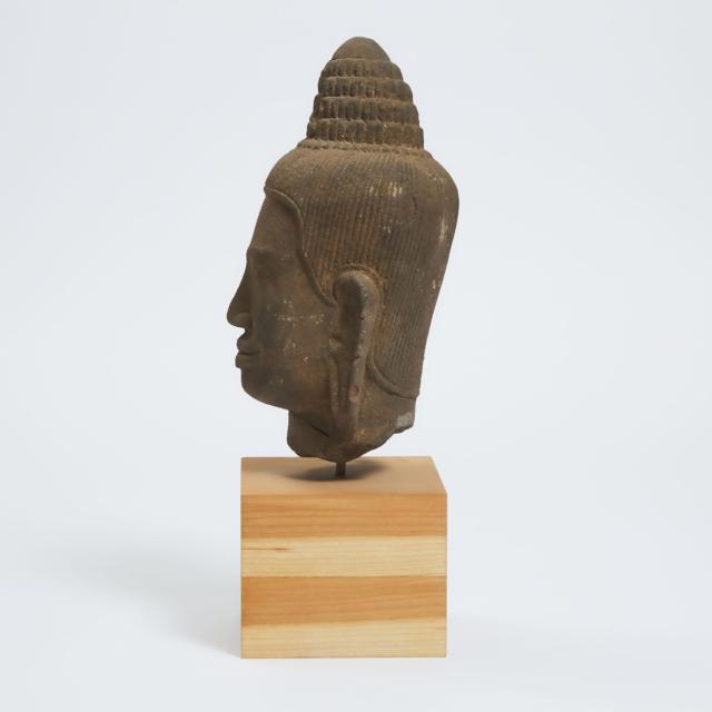 A Khmer Stone Head of Avalokiteshvara, Cambodia, 14th Century