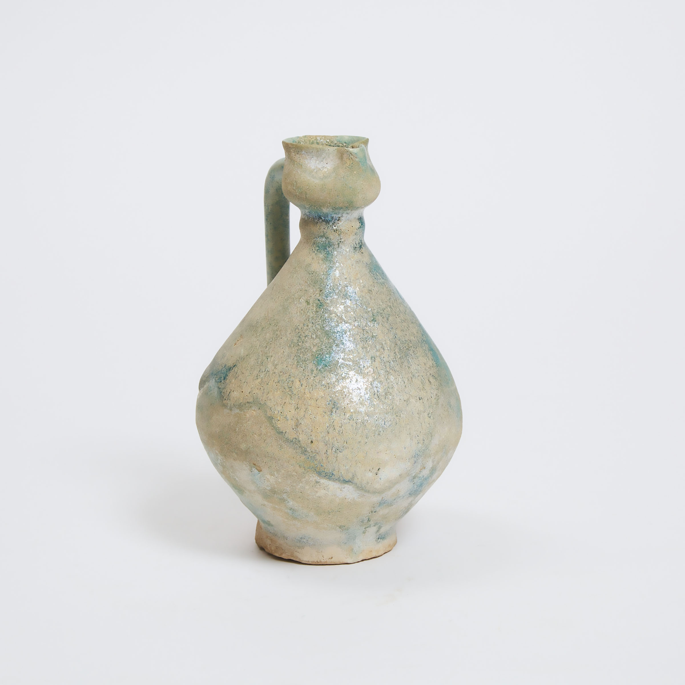 A Nishapur Turquoise-Glazed Pottery Jug, Iran, 12th/13th Century