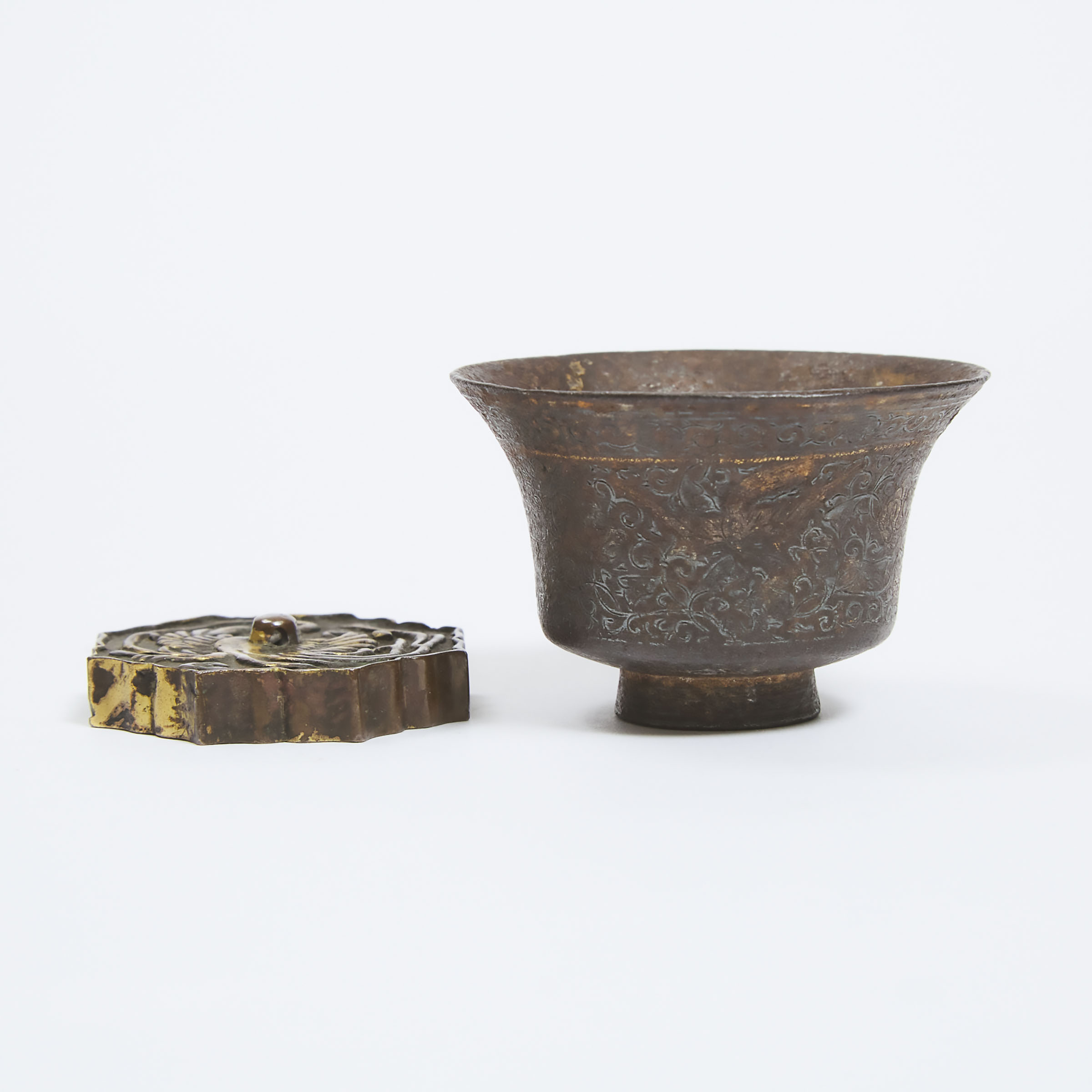 A Cast Silver Cup with Gilt Highlights, Together With a Gilt Bronze Paper Weight, Liao Dynasty or Later