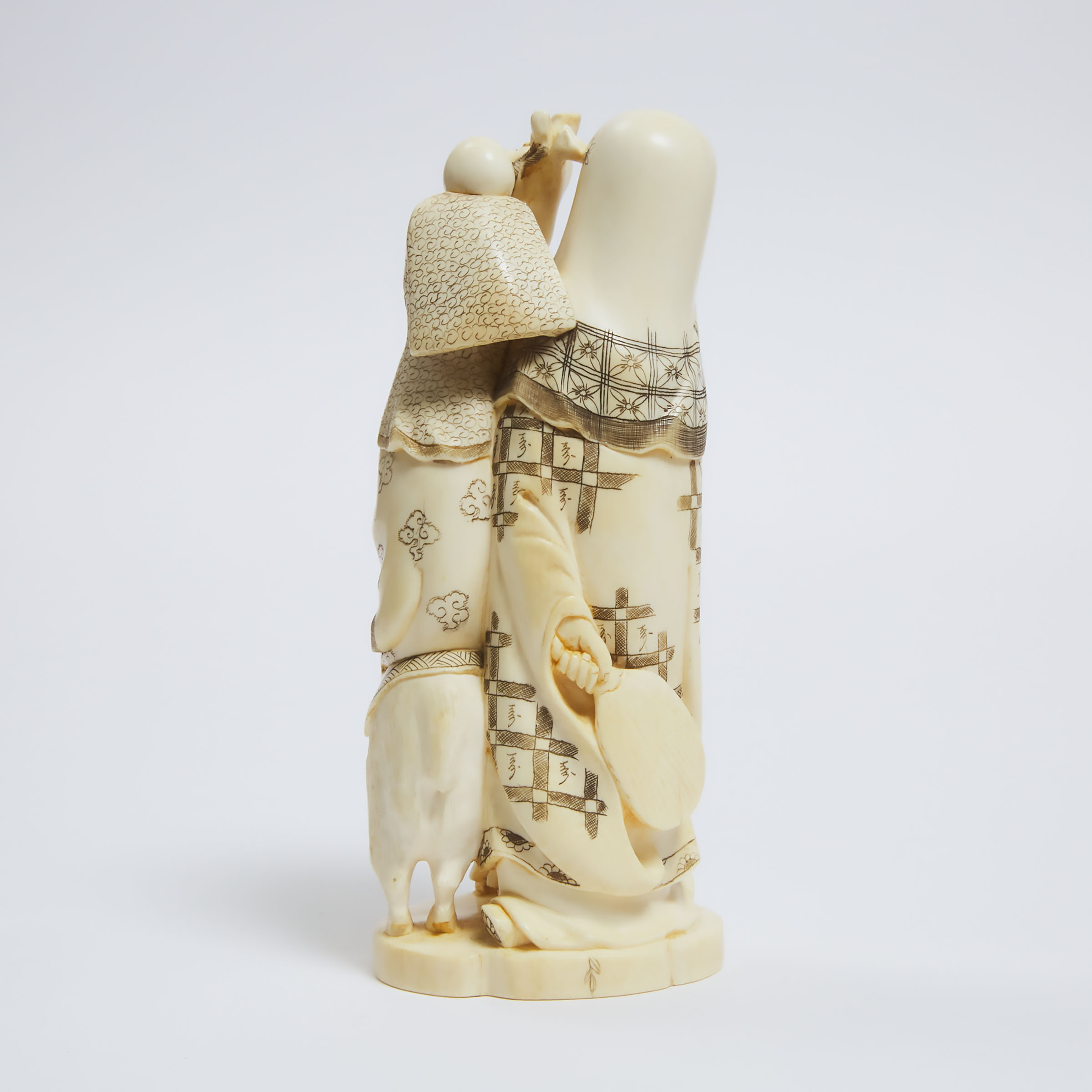 An Ivory Okimono of Two Immortals and a Ram, Early to Mid 20th Century