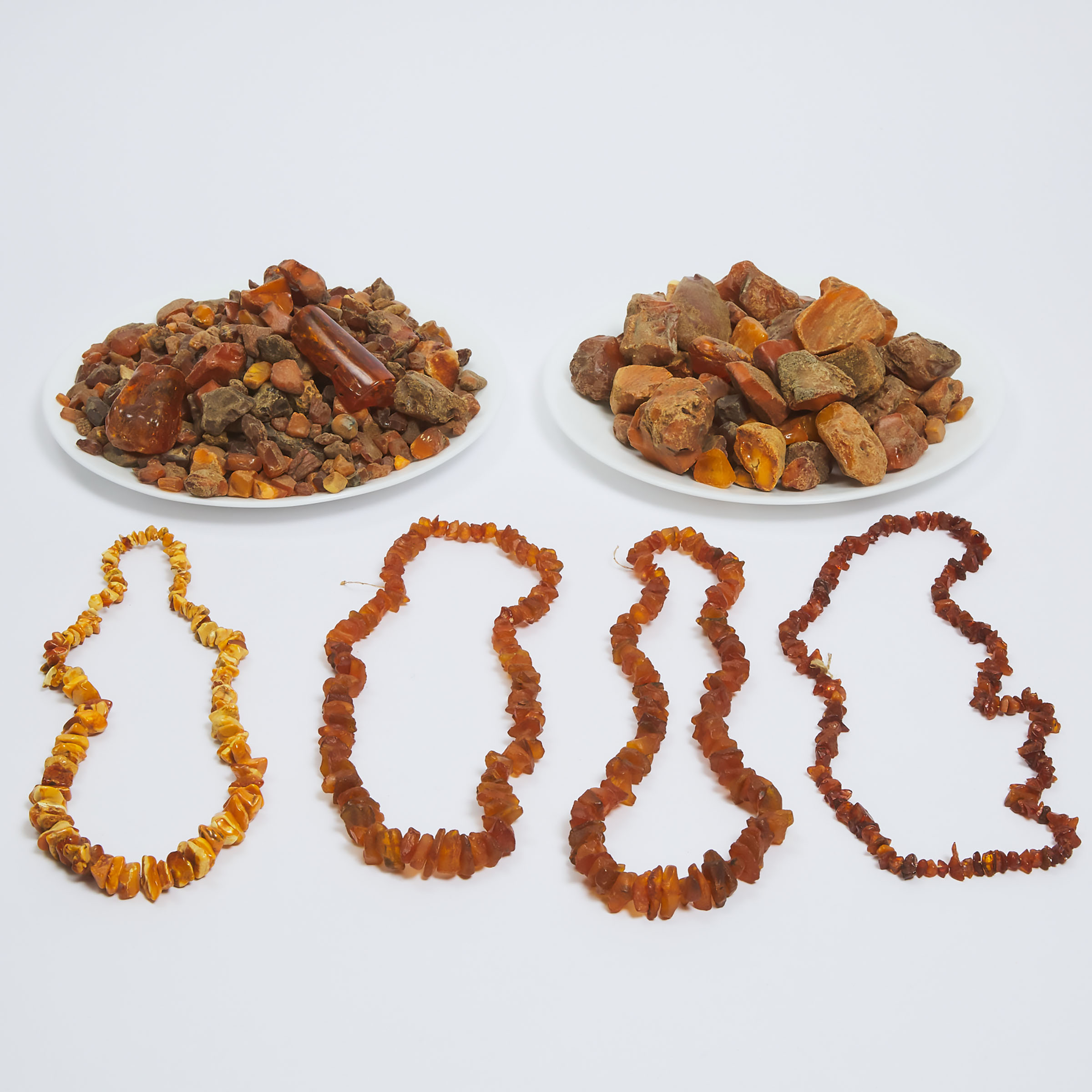 A Large Group of Amber Pieces and Necklaces