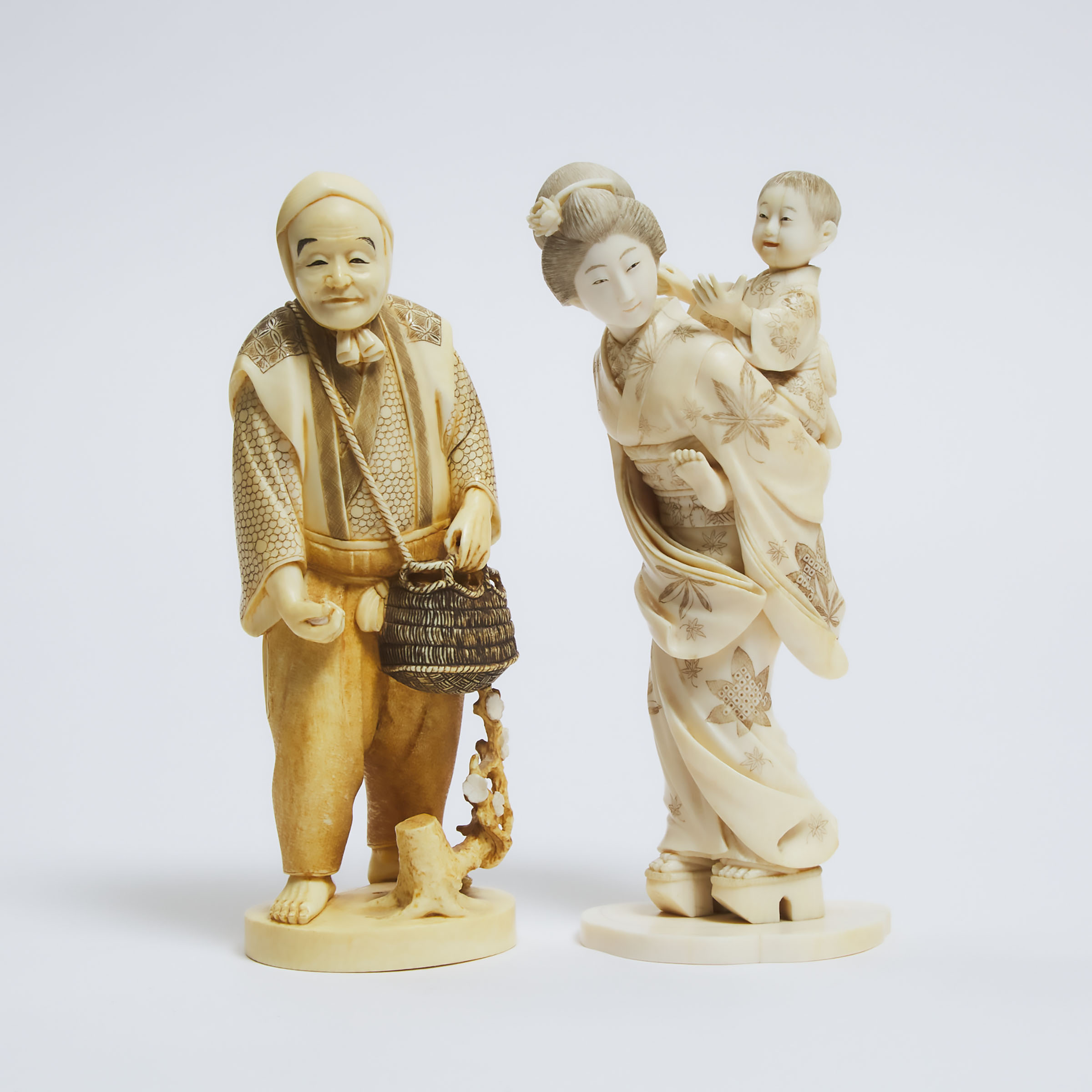 Two Ivory Okimono of a Lady and Child and a Farmer, One Signed Tomochika, Meiji Period (1868-1912)