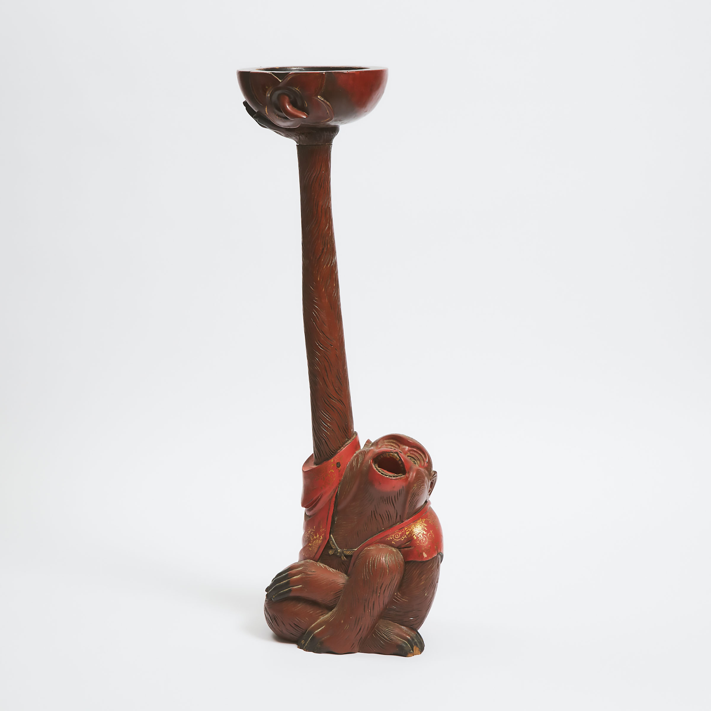 A Large Japanese Red Lacquered Wood Candlestick in the Form of a Monkey
