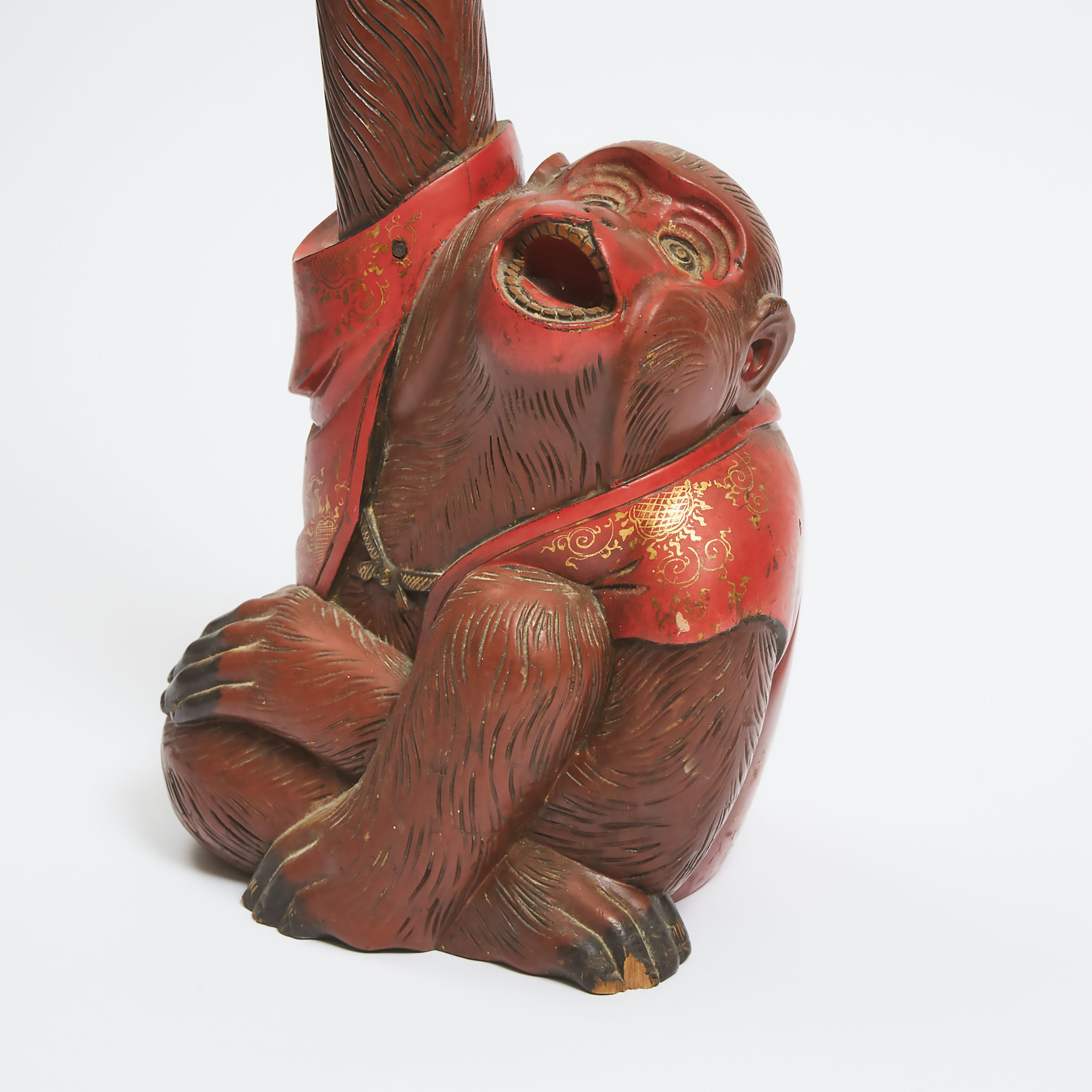 A Large Japanese Red Lacquered Wood Candlestick in the Form of a Monkey