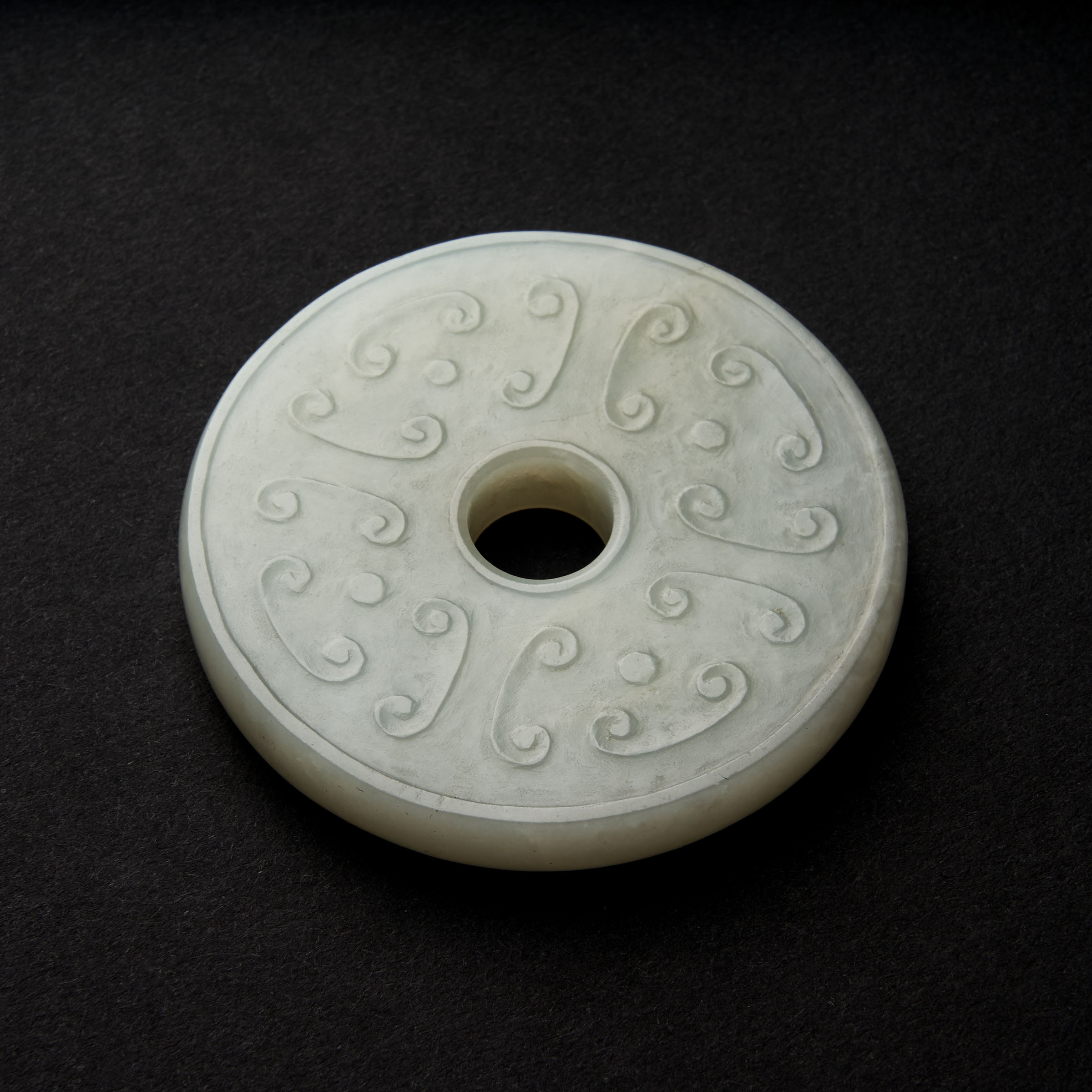 A White Jade Archaistic Bi Disc, Qing Dynasty, 19th Century