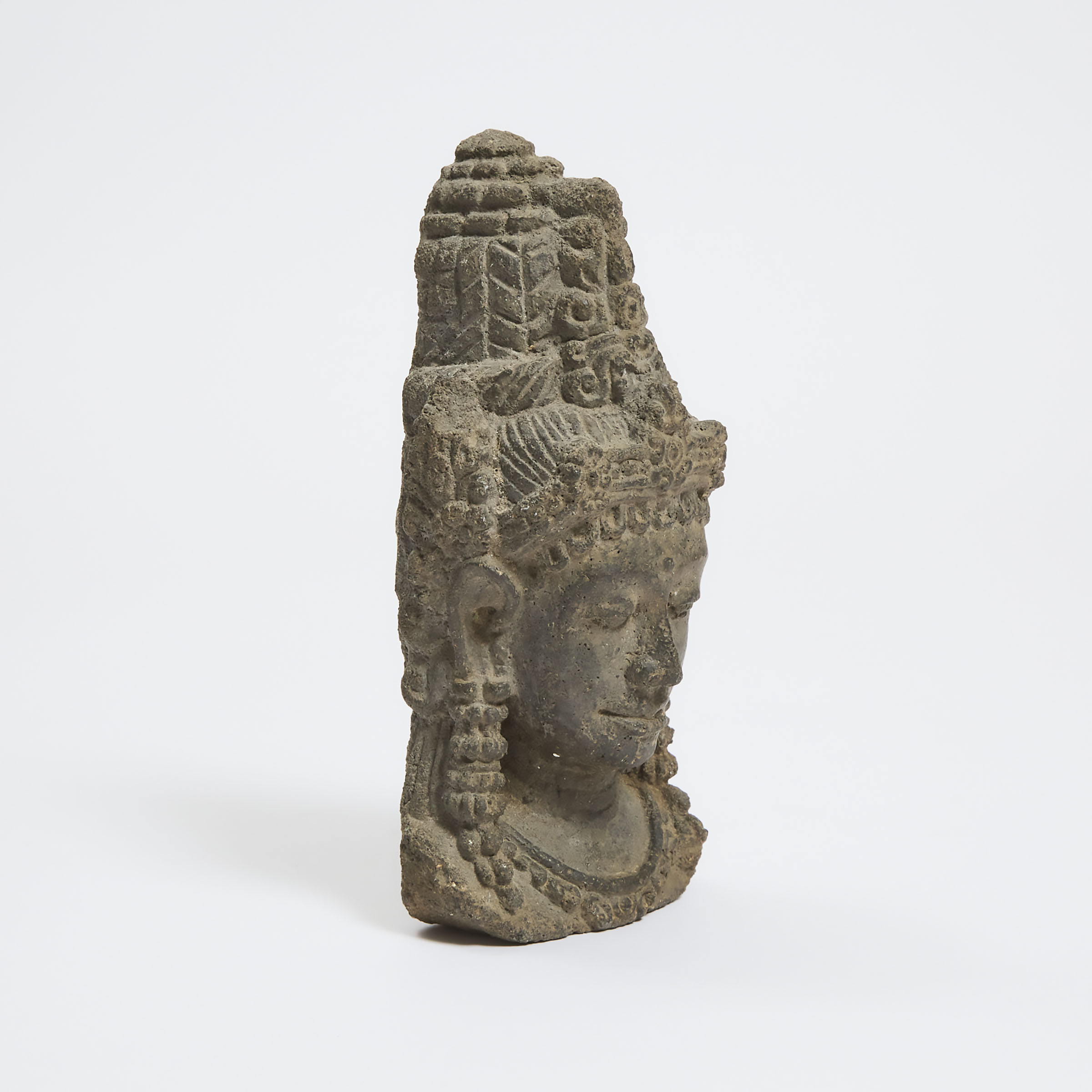 A Volcanic Stone Head of a Deity, Java, 14th Century